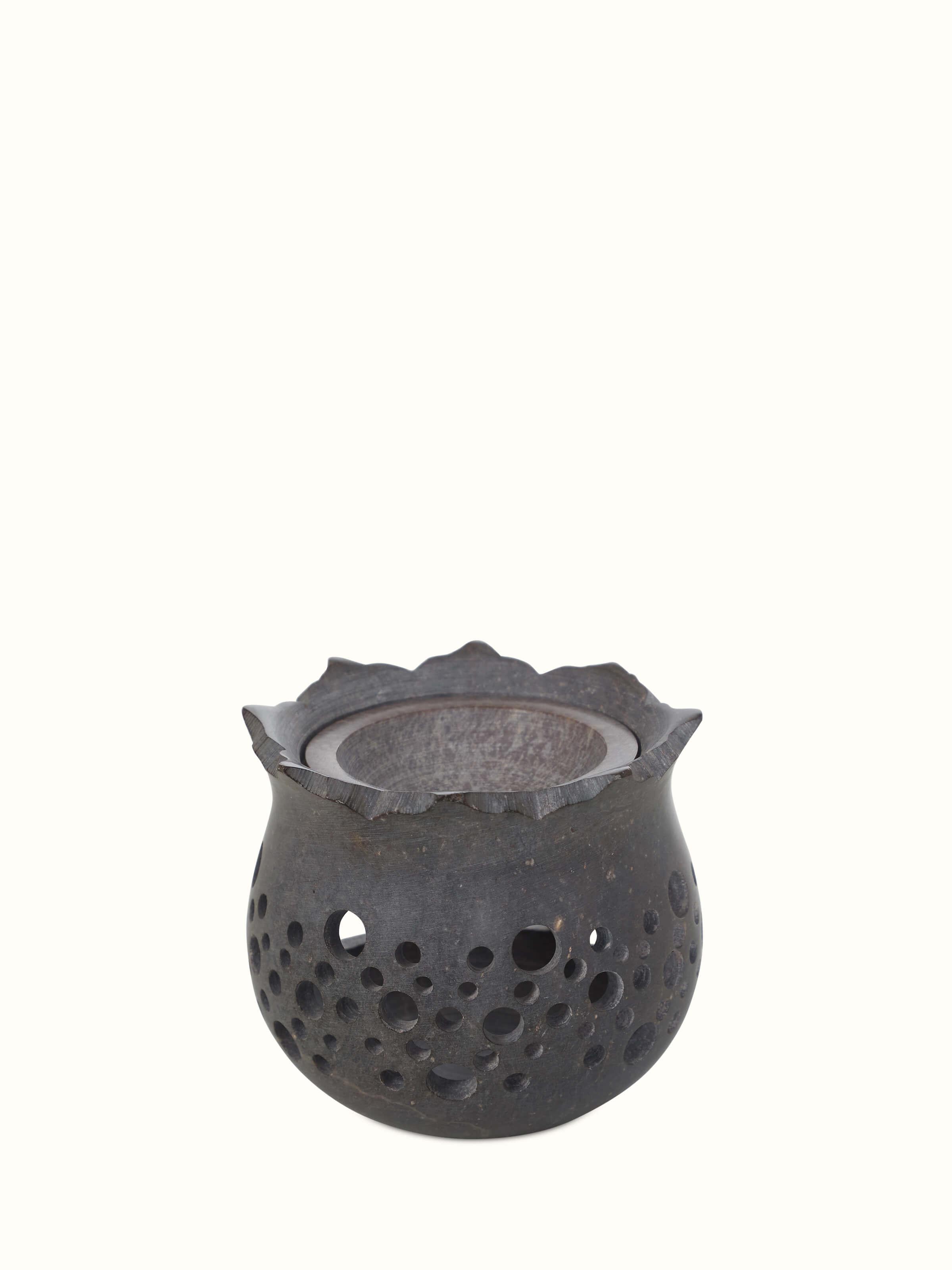 Detailed view of hand-carved stone diffuser.