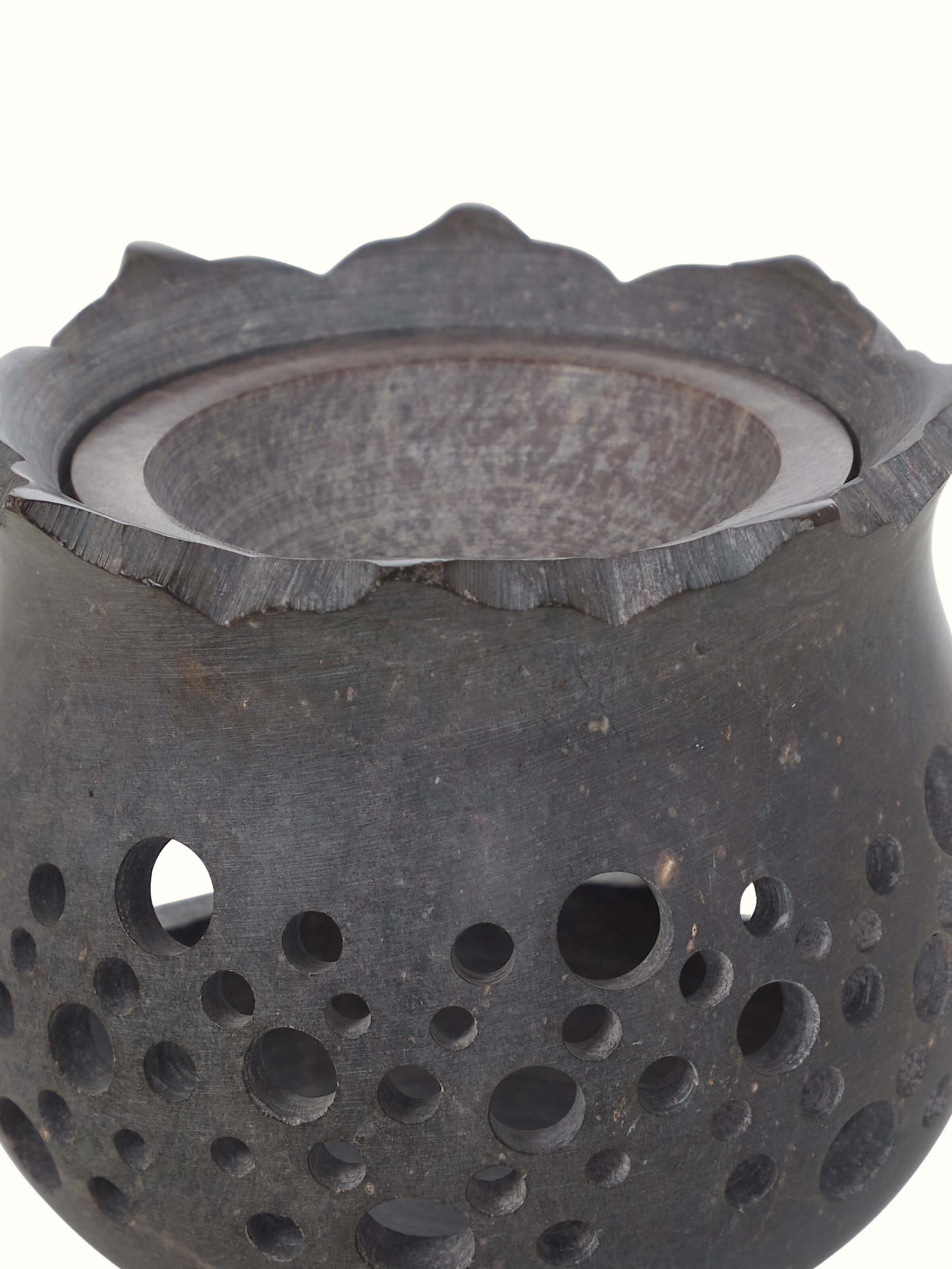 Close-up view of hand-carved stone diffuser.