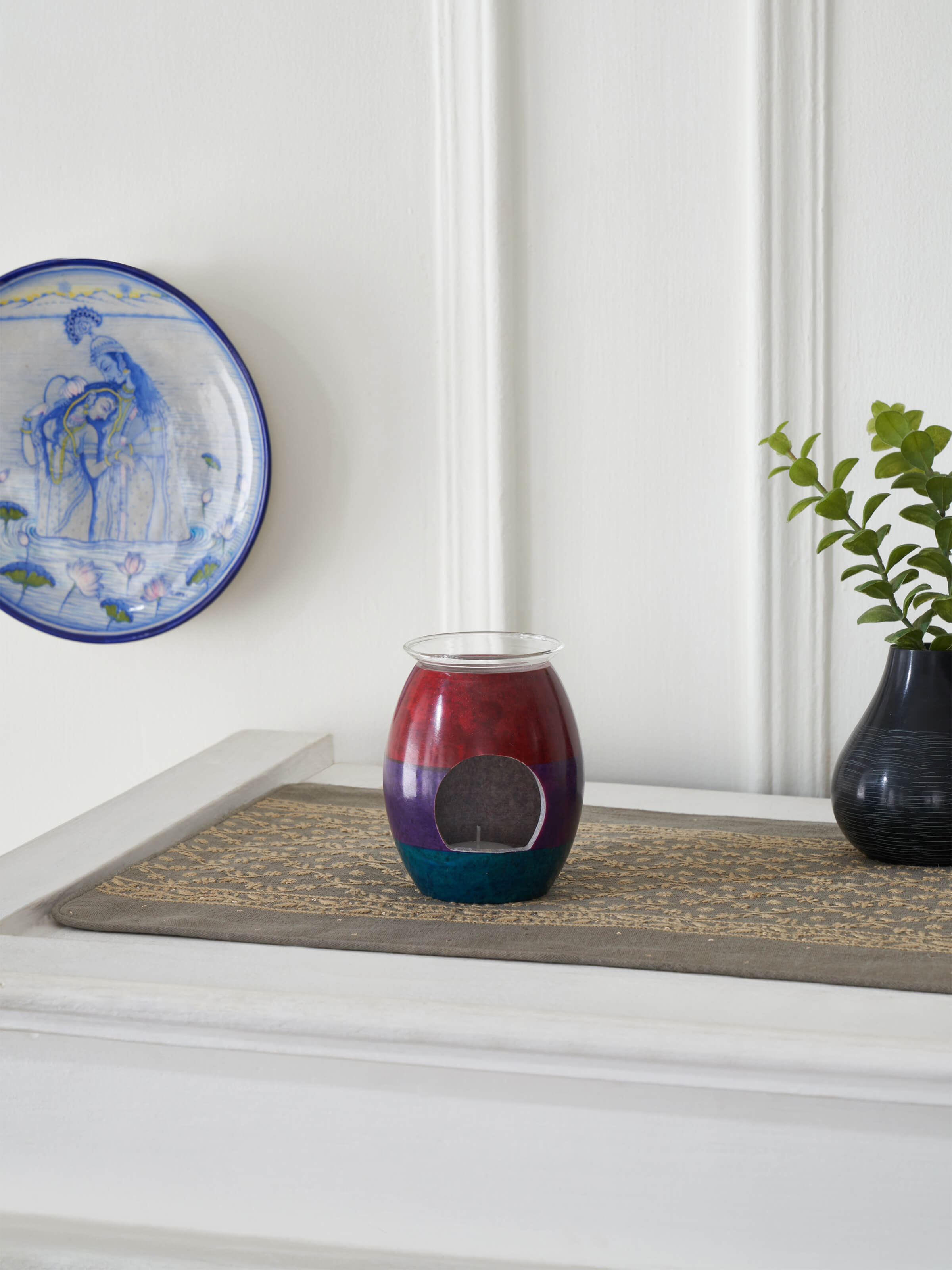 Side view of Carved stone diffuser in multicolor highlighting its craftsmanship