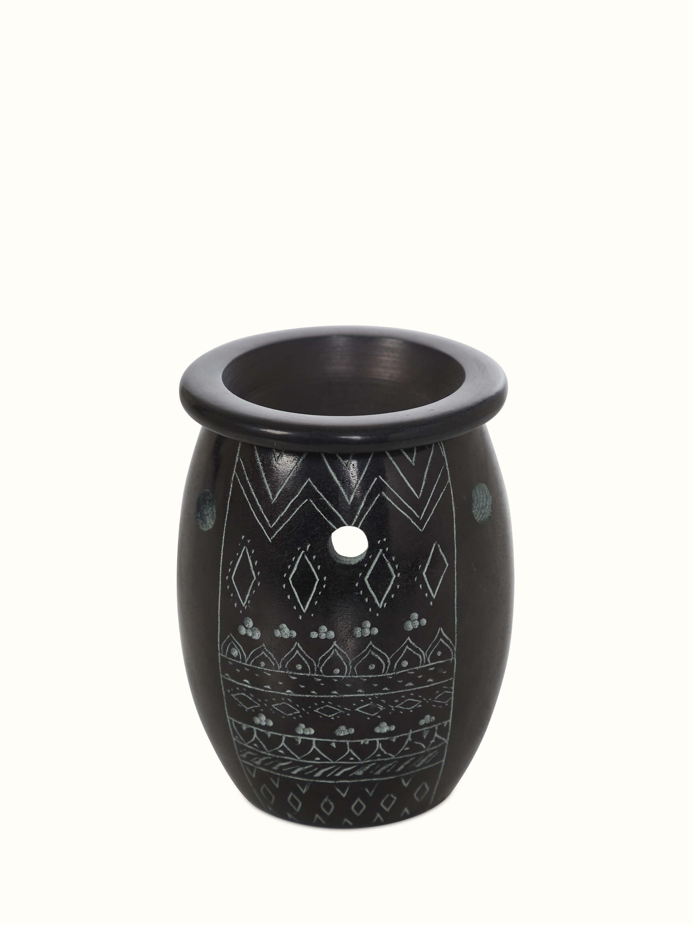 Full view of the carved stone diffuser, emphasizing its decorative appeal and functional design.