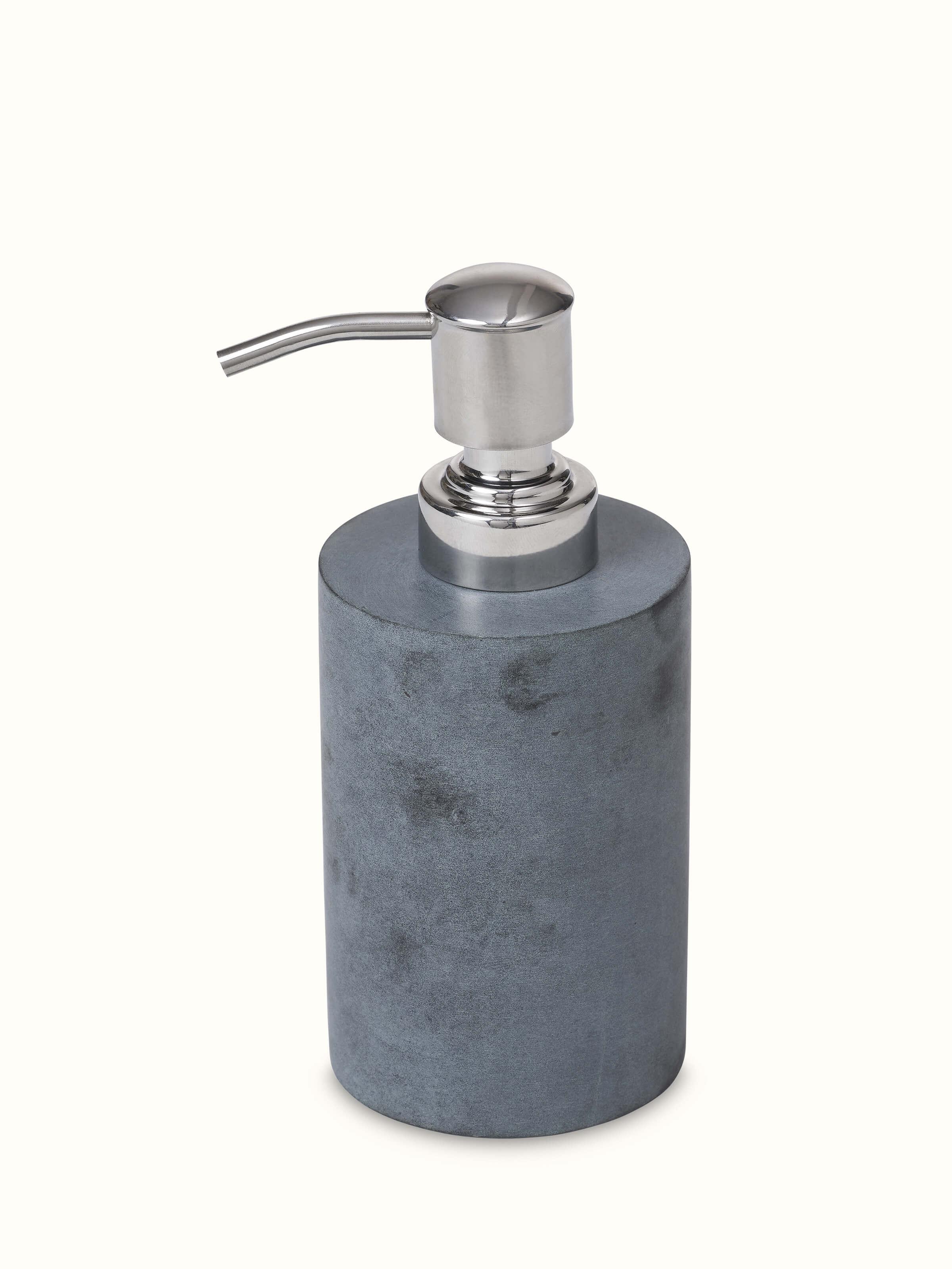 Close-up view of glossy carved stone soap dispenser emphasizing the detailed carving and high-gloss finish.