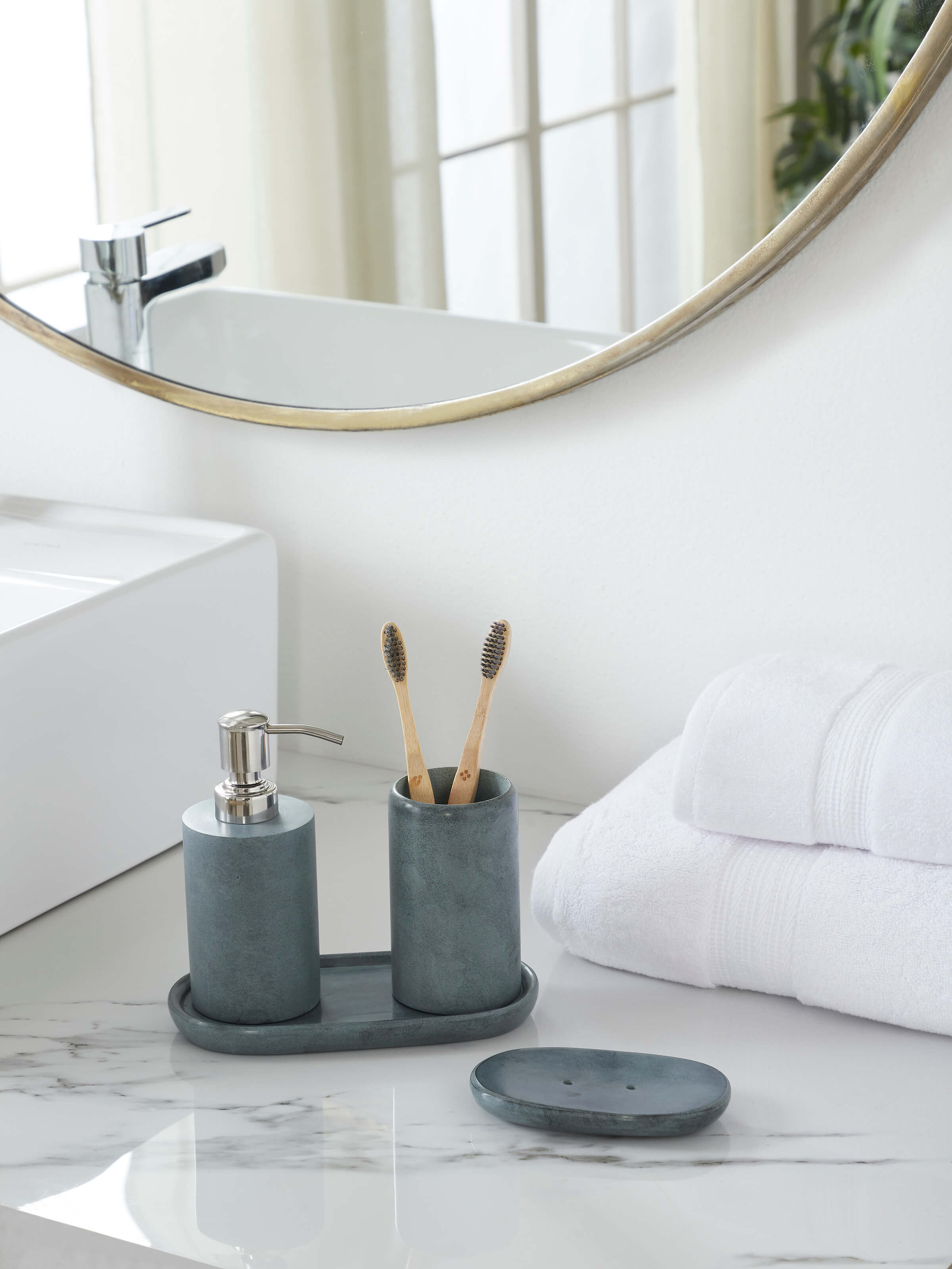 Side view of Natural Carved Stone Toothbrush Holder, highlighting the cylindrical shape and natural stone finish