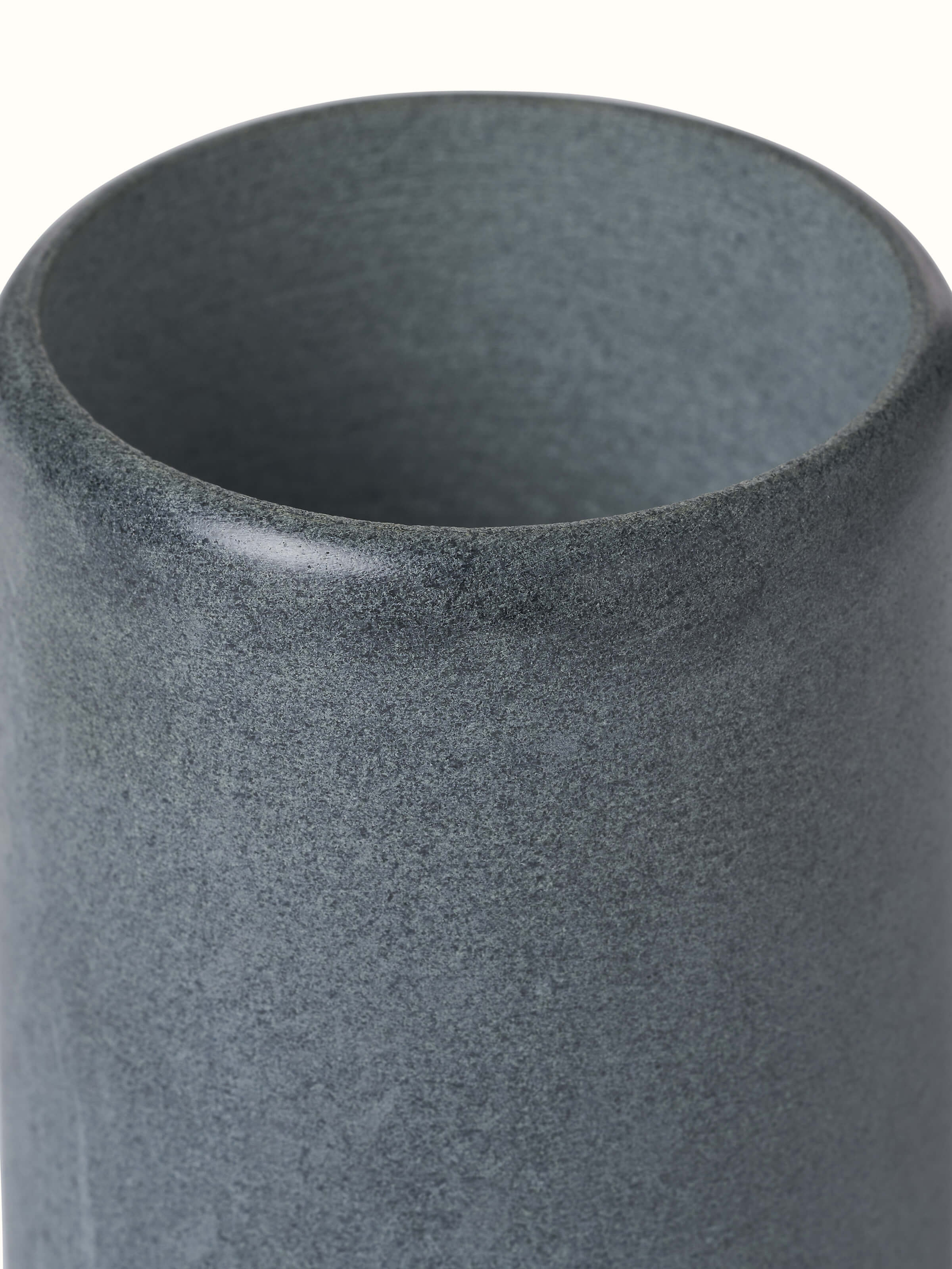 Angled view of Natural Carved Stone Toothbrush Holder, showing the functionality and design