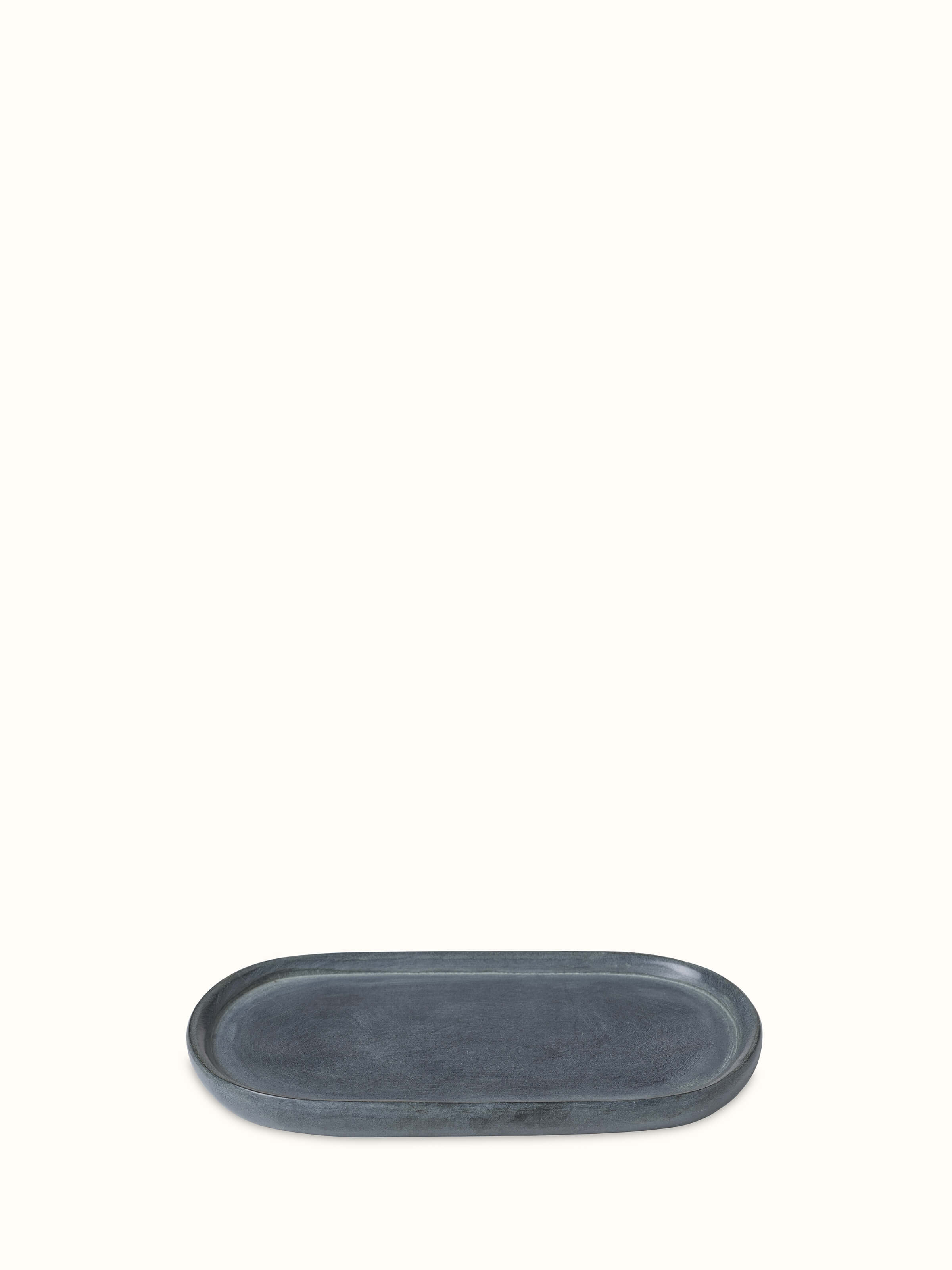 Natural carved stone bath tray with elegant and smooth design, ideal for bathroom decor.