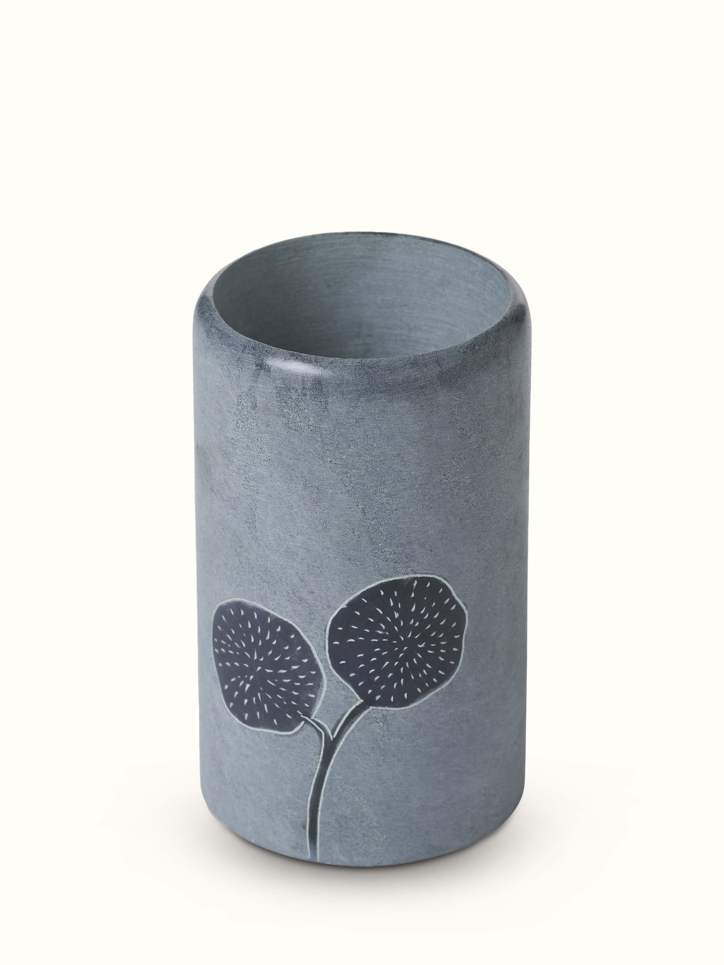 Close-up of Carved stone toothbrush holder with detailed carving