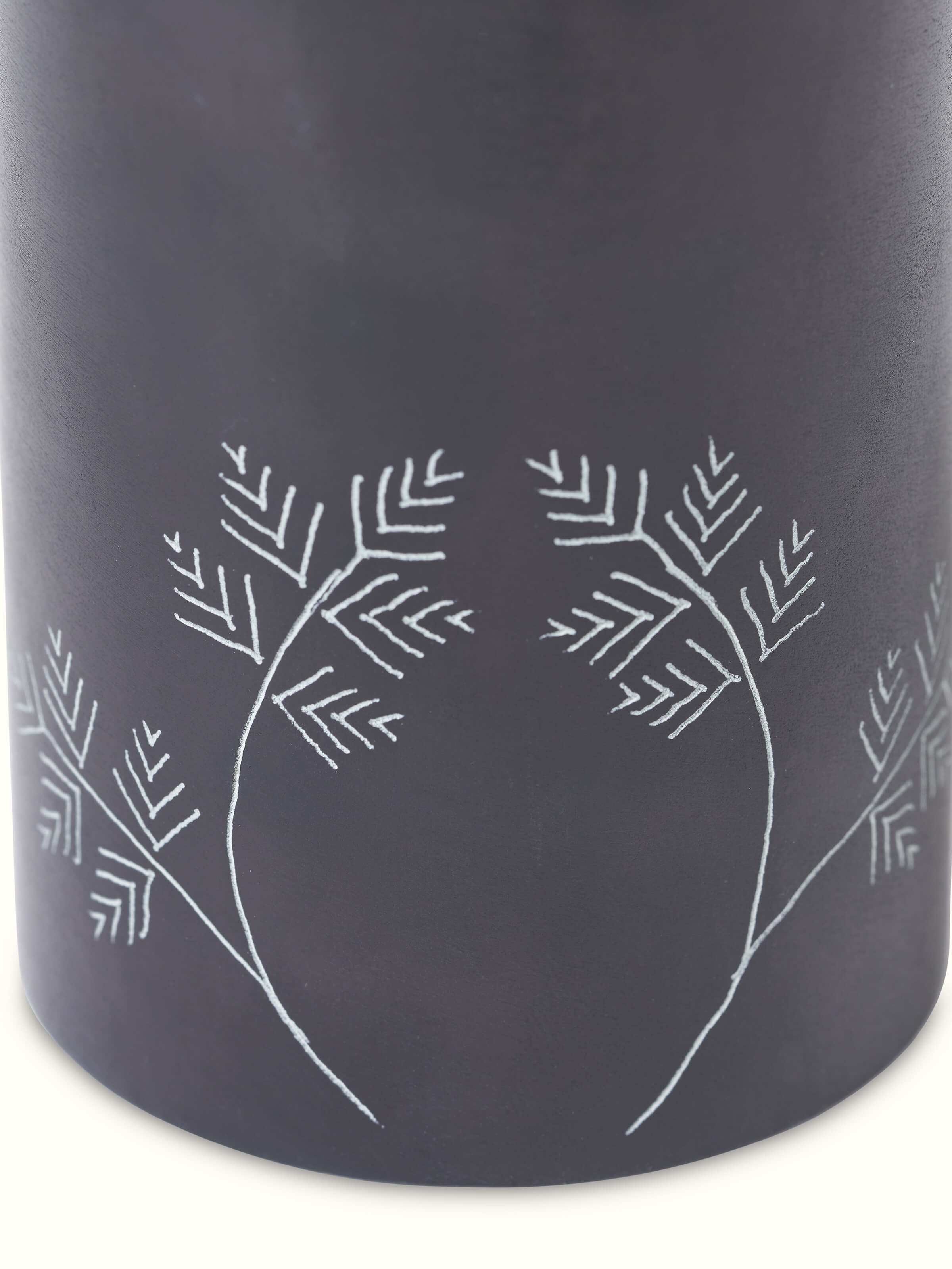 Detailed view of glossy carved stone toothbrush holder focusing on the fine carving details