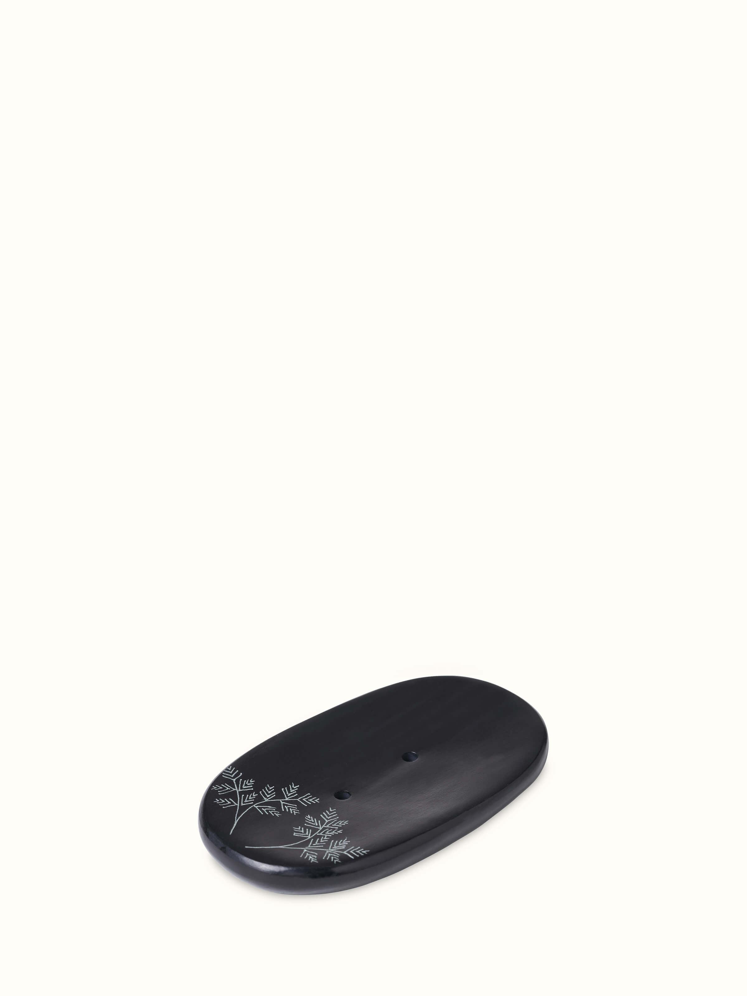 Detailed close-up of Glossy Carved Stone Soap Dish, focusing on the intricate carving and smooth texture