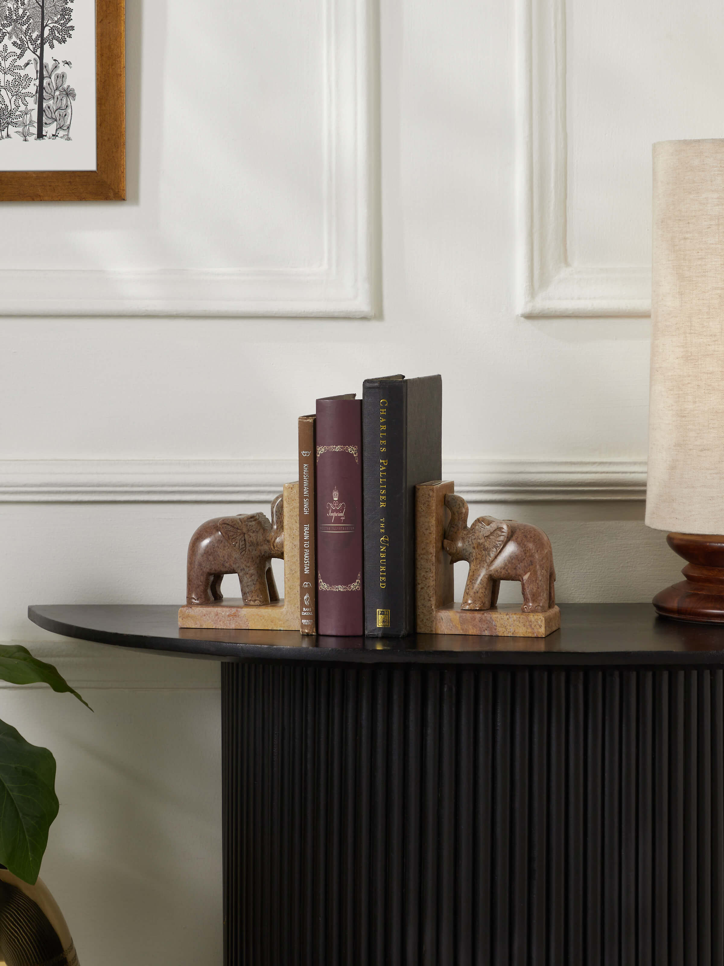 Side view of Carved Stone Bookend in Brown Color, focusing on its textured surface and carving details