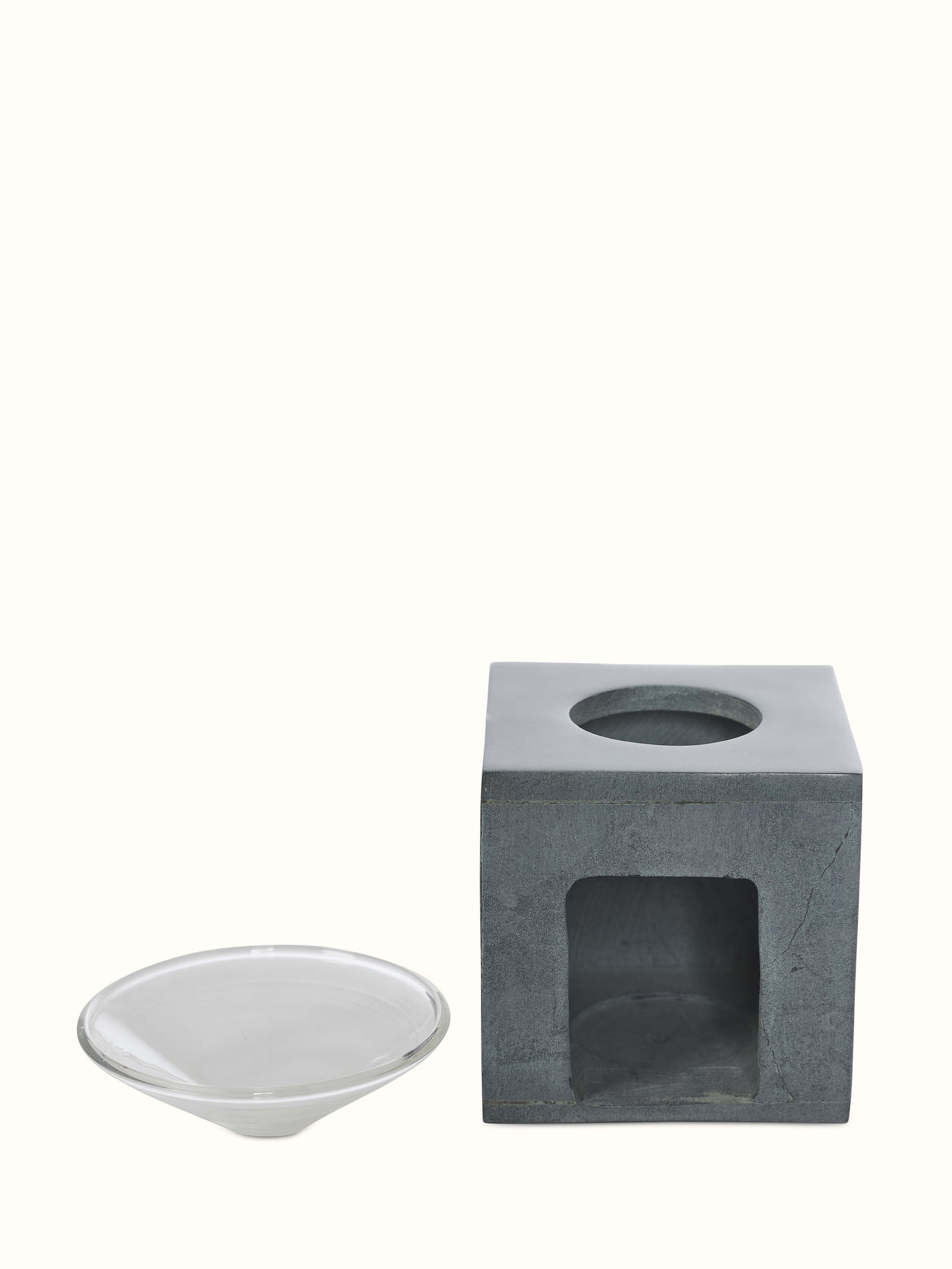 Close-up view of Carved stone diffuser in grey color focusing on the fine details and textural elements