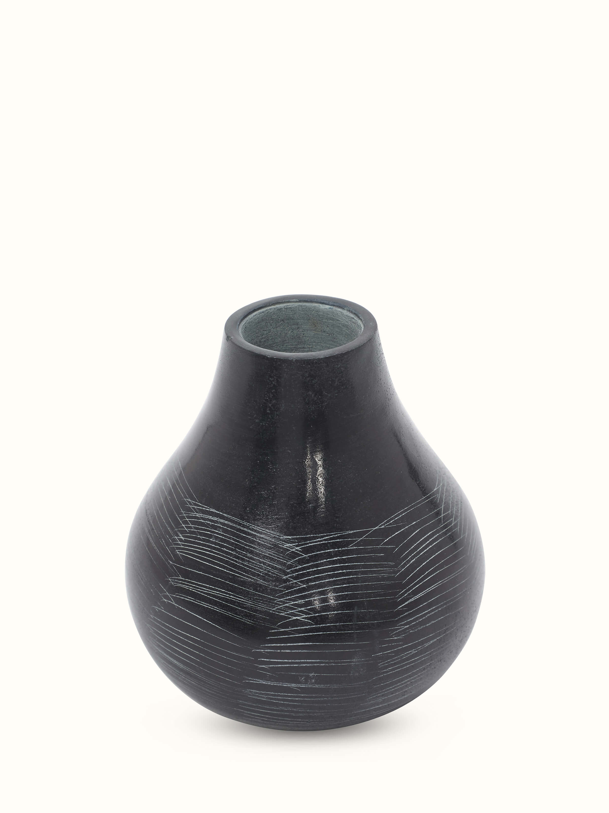 Front view of carved stone vase in black color with elegant and refined design