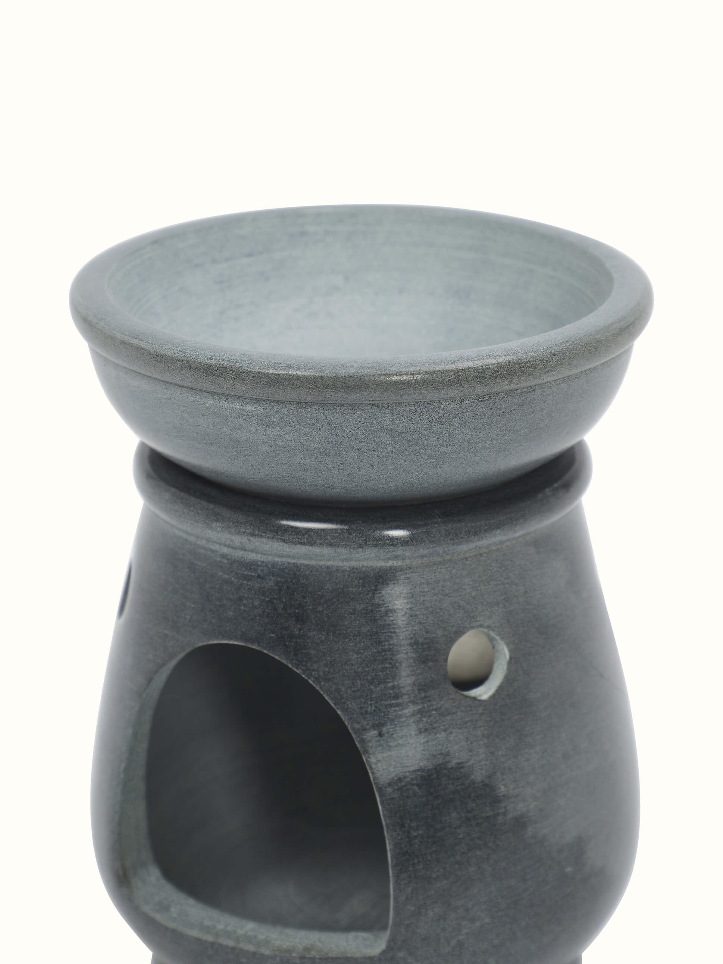 Angle view of Traditional carved stone diffuser emphasizing its handcrafted design.