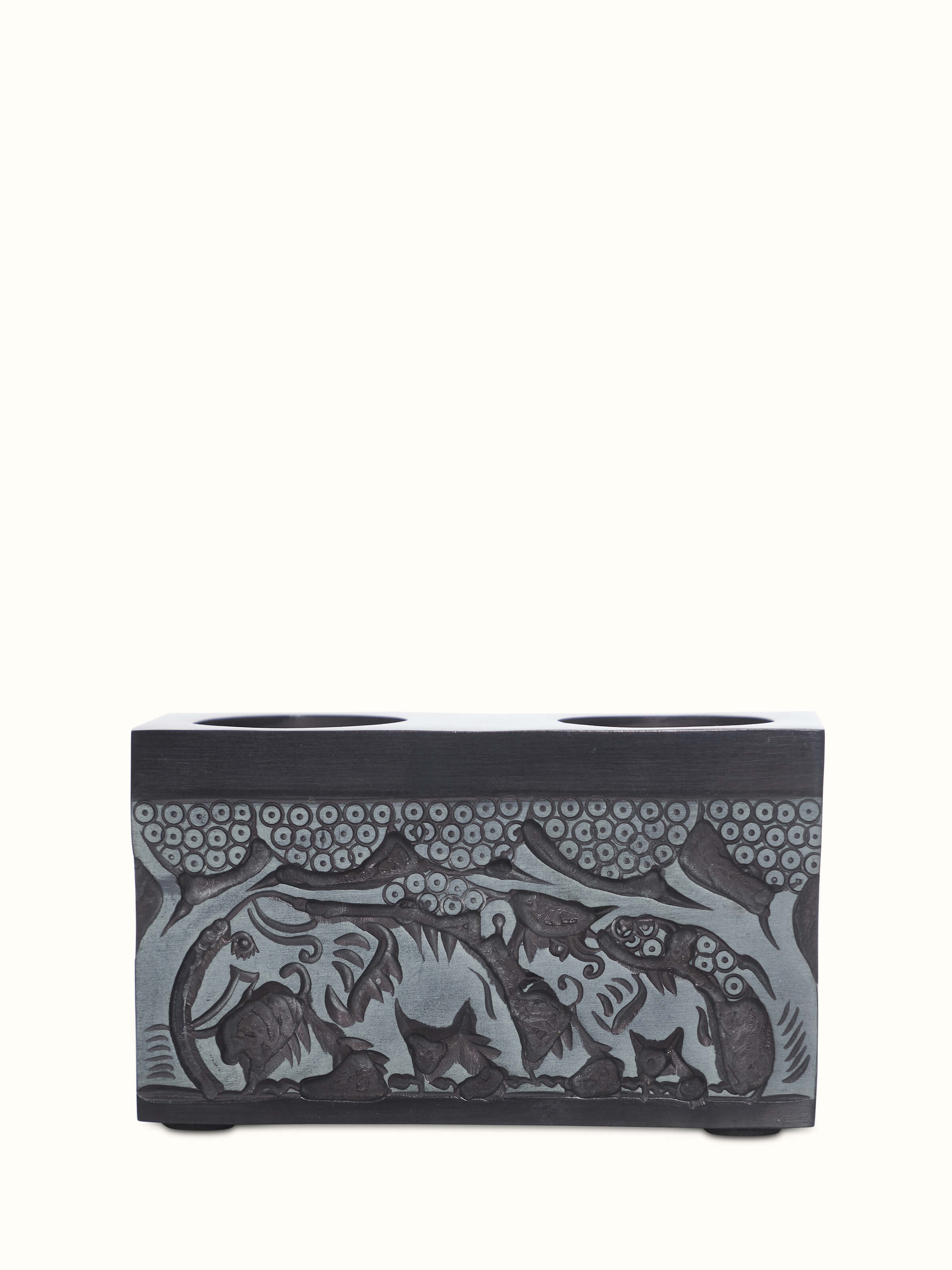 Front view of Transitional Carved Stone Tea Light Holder, featuring intricate stone carvings and elegant design.
