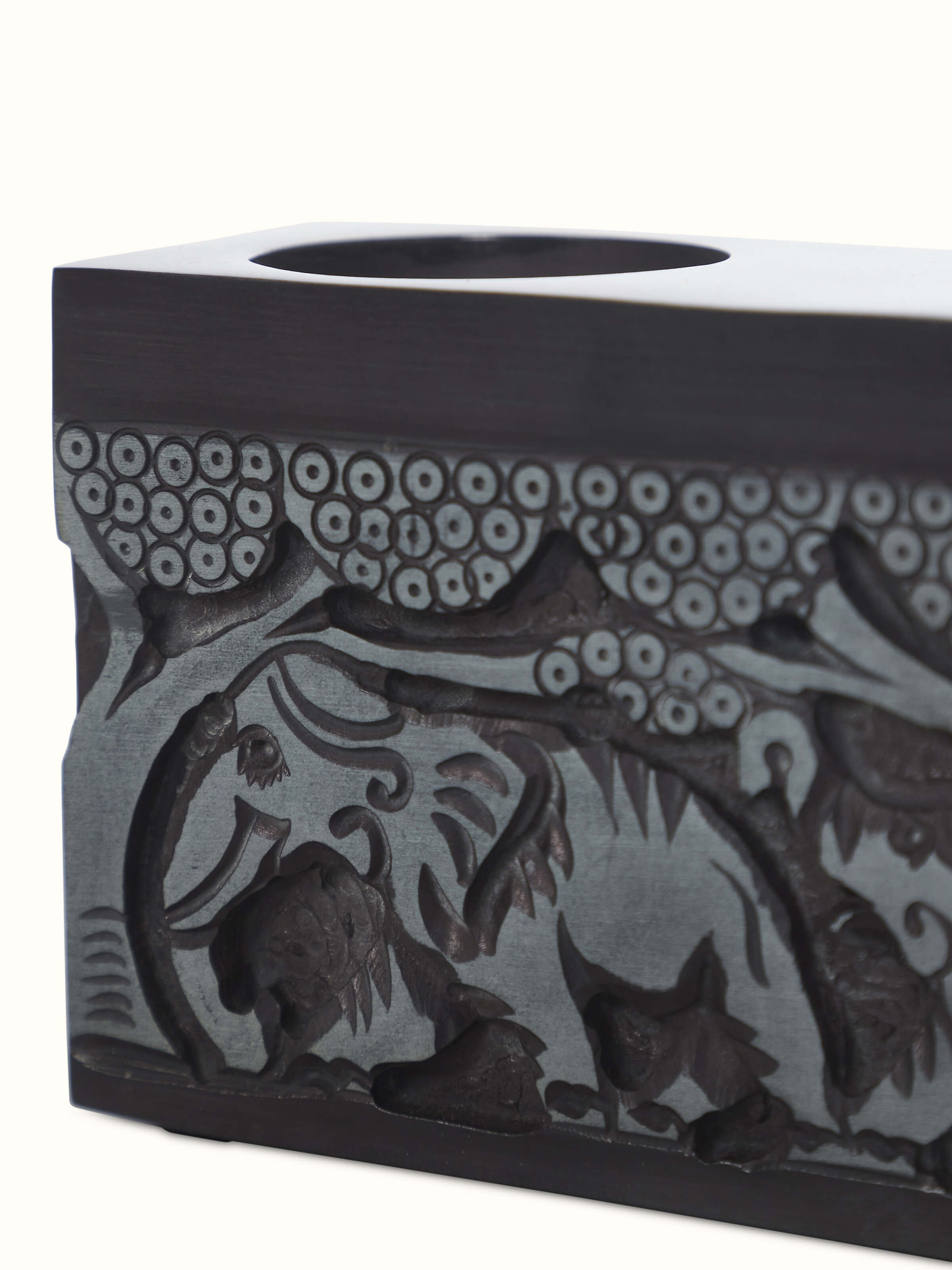 Detailed view of Transitional Carved Stone Tea Light Holder, emphasizing the craftsmanship and finish.