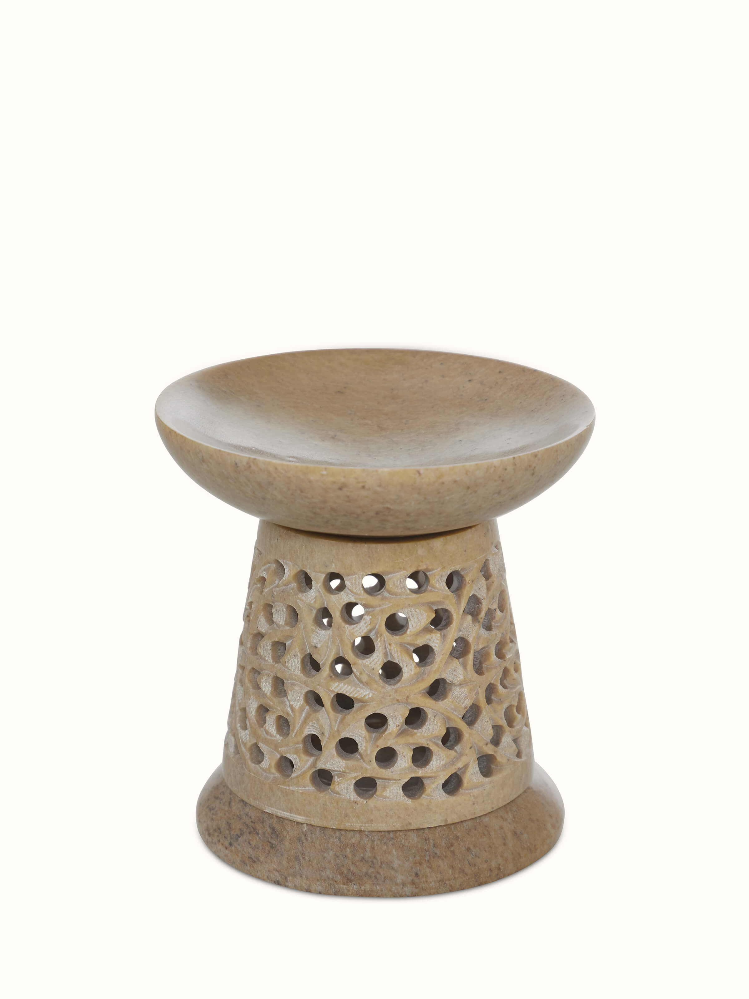 Front view of polished carved stone diffuser with intricate transitional design and refined finish