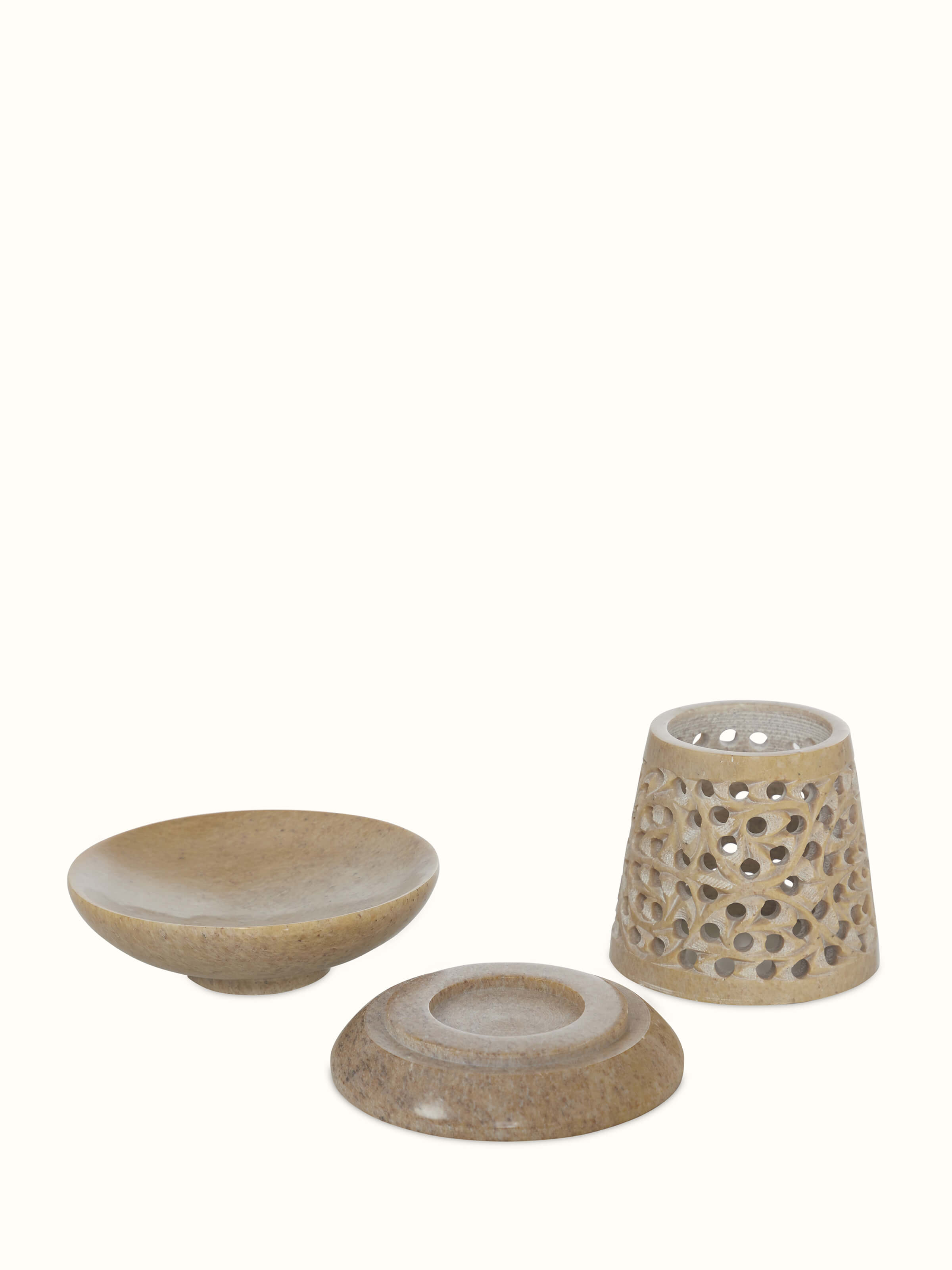 Close-up of polished carved stone diffuser focusing on detailed transitional design elements