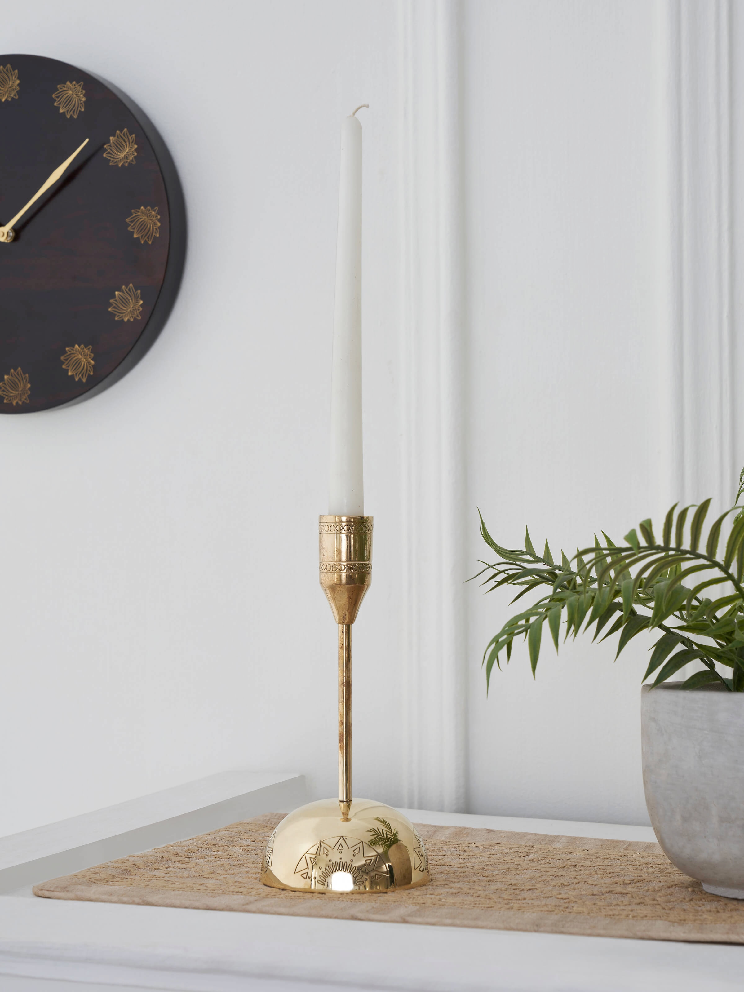 Side view of Polished brass candle holder