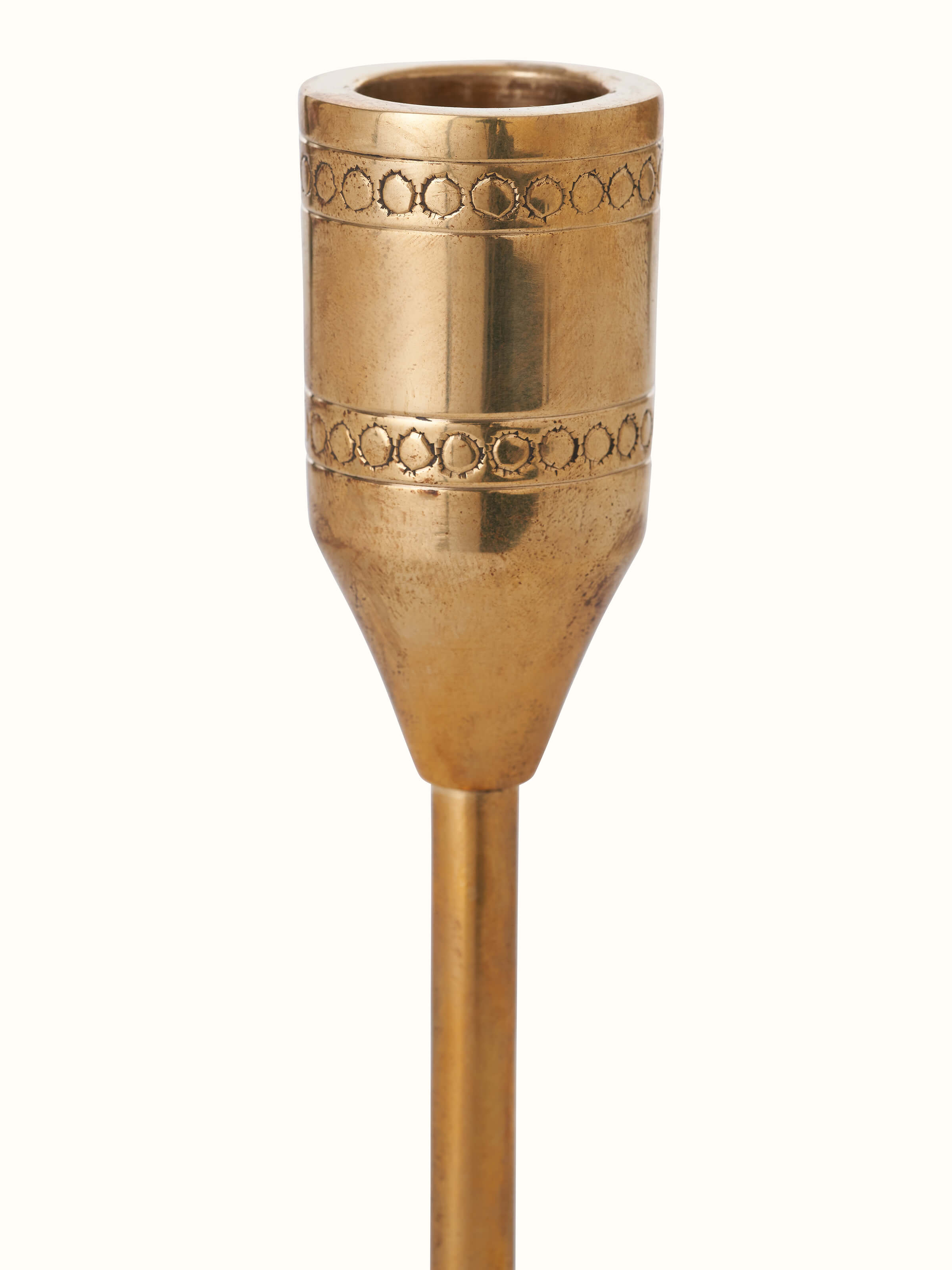 Detailed view of Polished brass candle holder