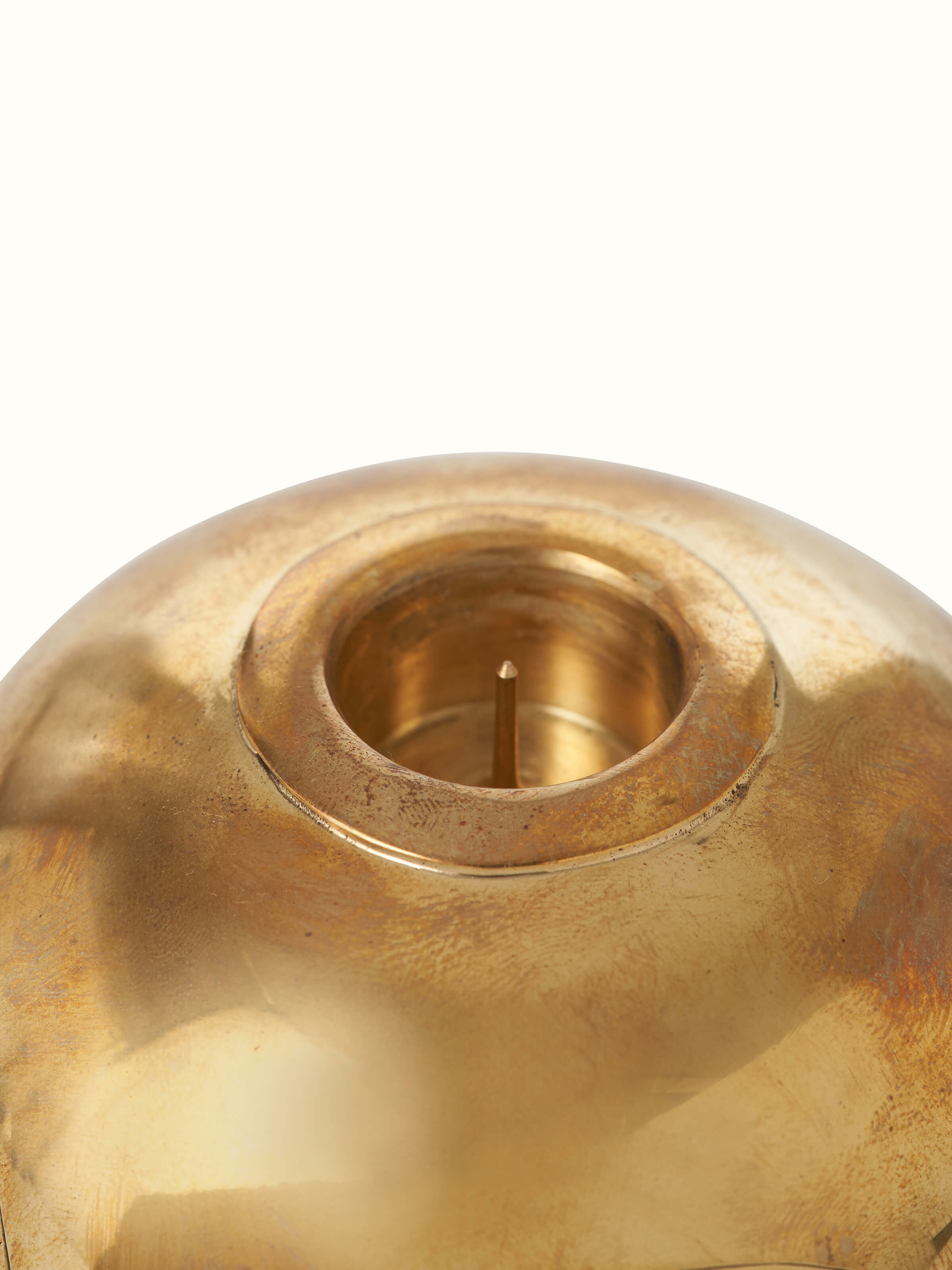Close-up view of Polished brass candle holder