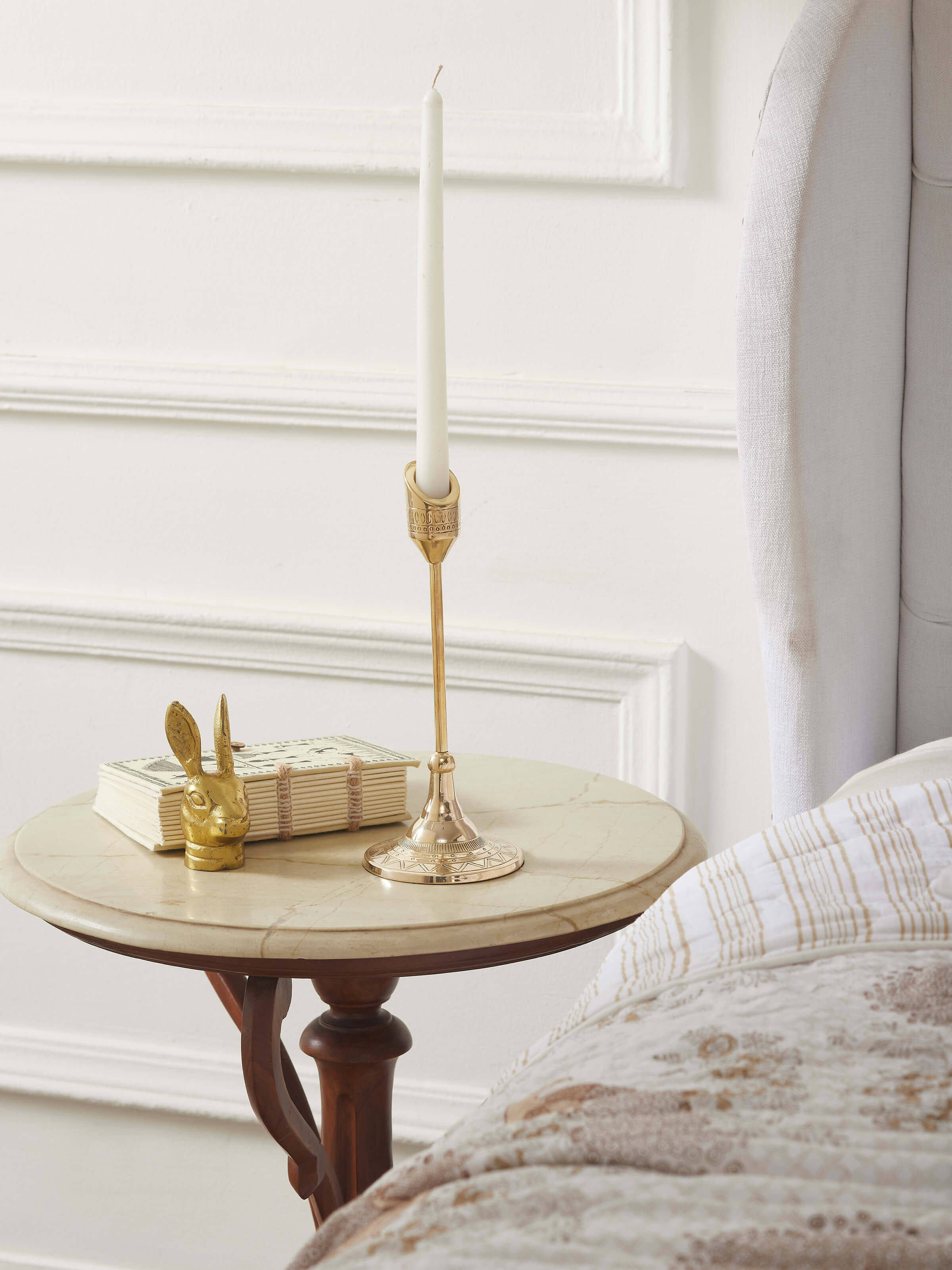 Close-up view of natural brass candle stand, showcasing its detailed craftsmanship.