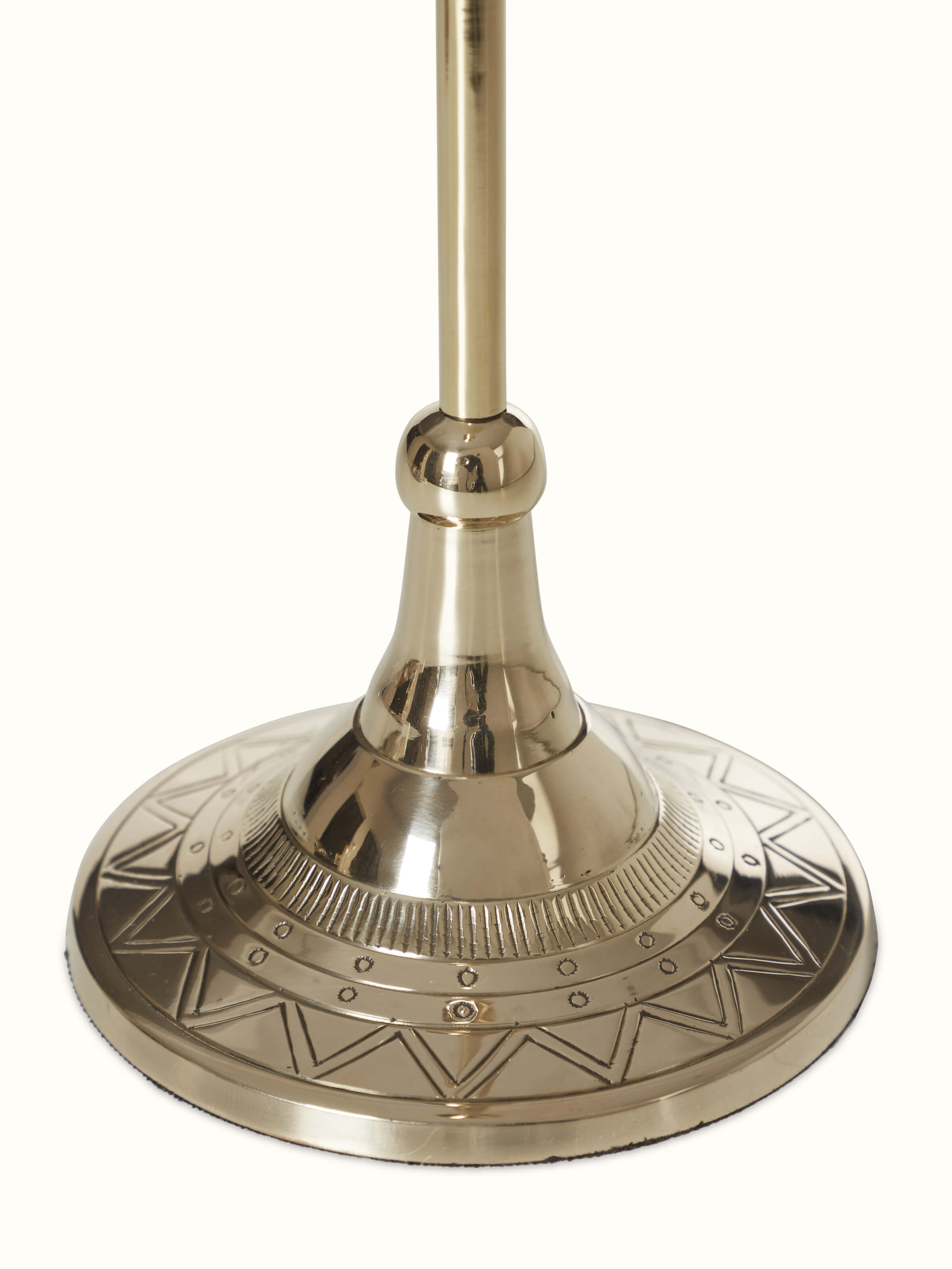 Detailed shot of natural brass candle stand, emphasizing its elegant finish and design.