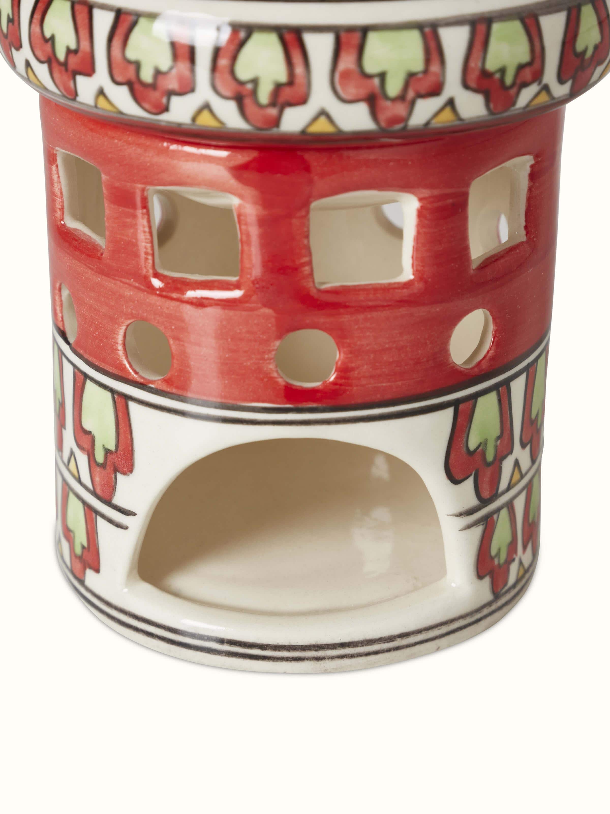Angled view of natural Khurja pottery ceramic aroma oil burner showcasing the elegant design and natural glaze finish