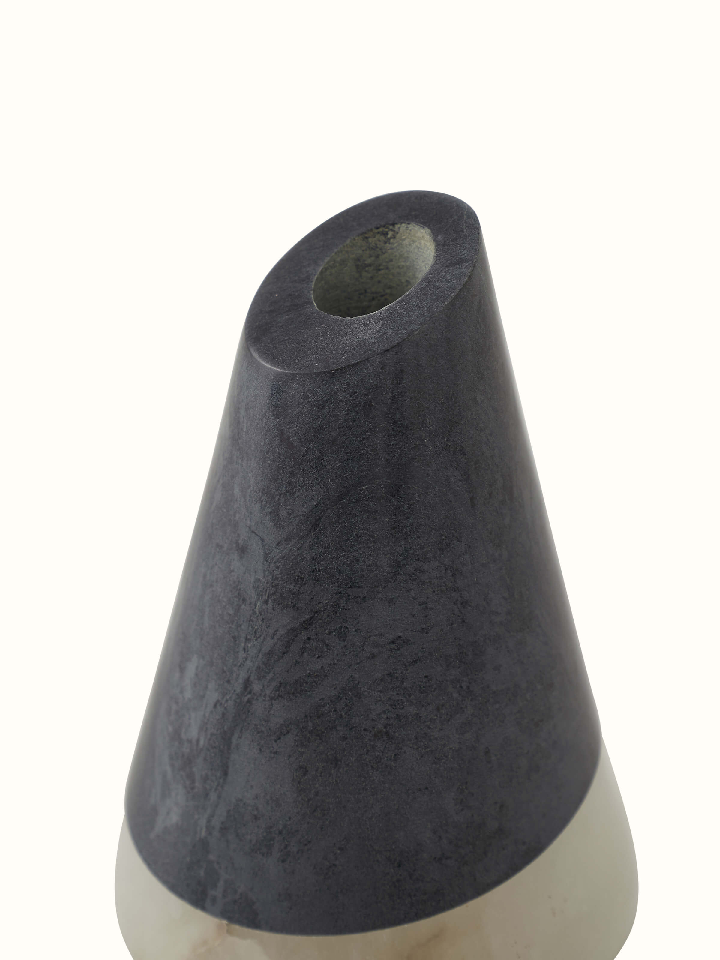 Detailed view of carved soapstone bud vase in black color showing fine carvings
