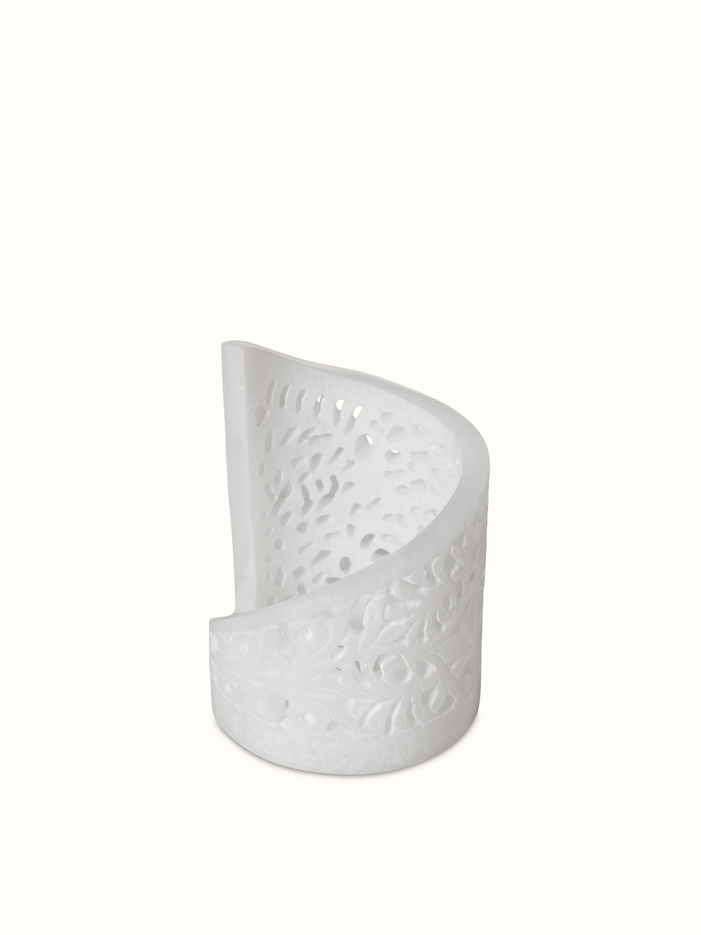 Top view of polished carved soapstone tea light holder, emphasizing the detailed carvings and polished finish.