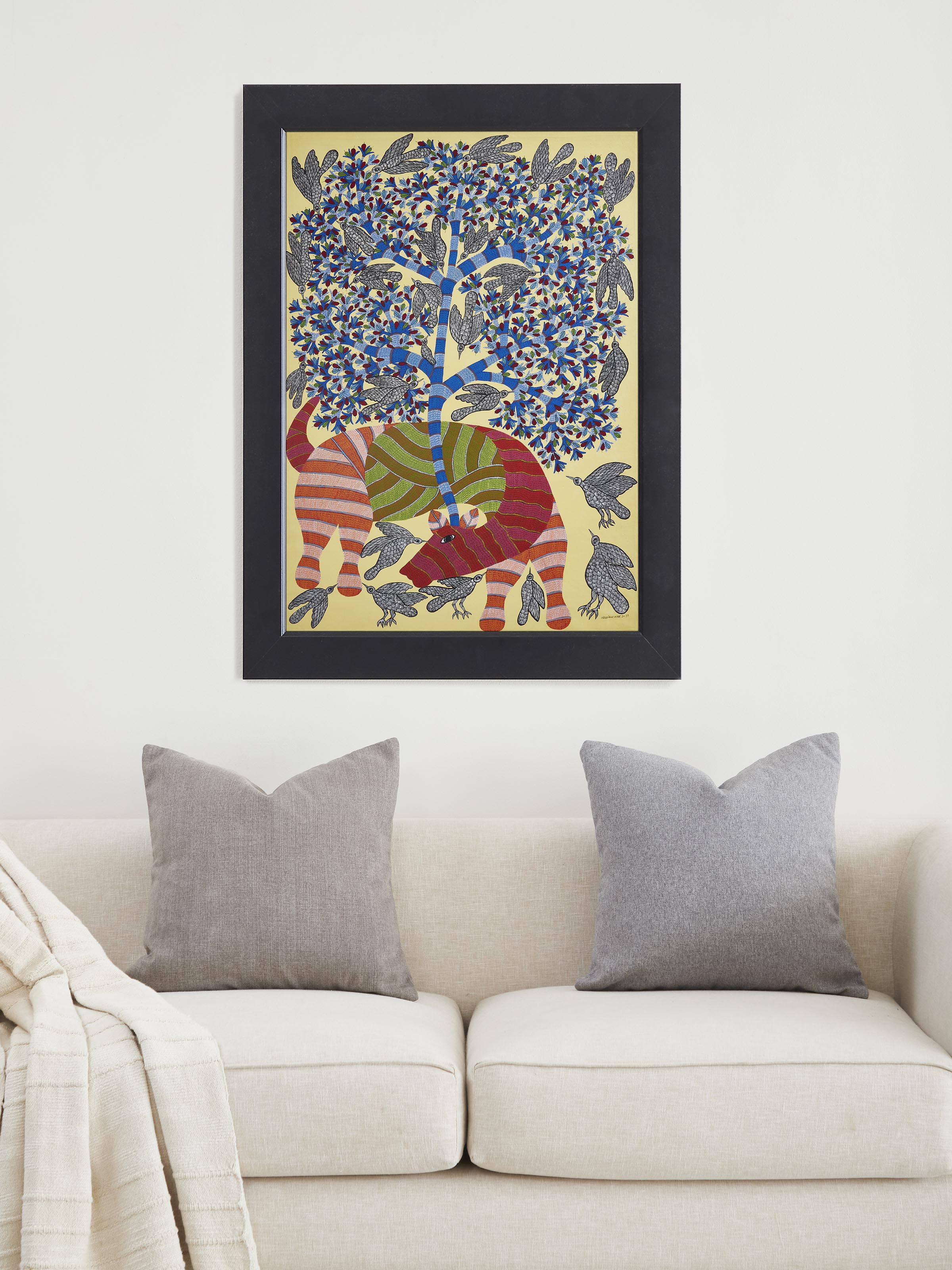Side view of Gond Cow & Birds with Tree Painting by Swadesh highlighting the composition of cow, birds, and tree elements in the artwork.