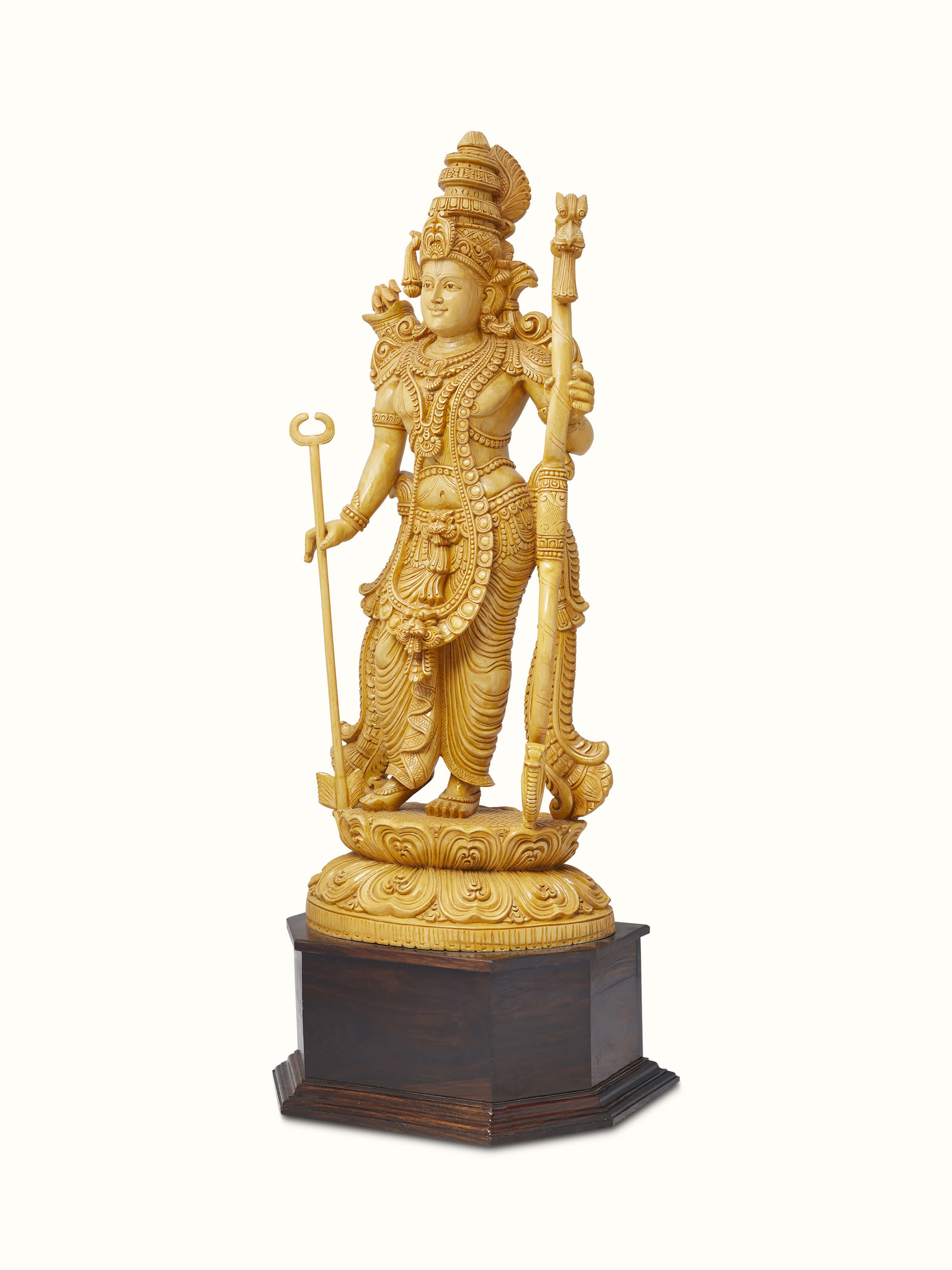 Angled view of Jaitra carved Shivani wood ram idol highlighting the intricate carvings