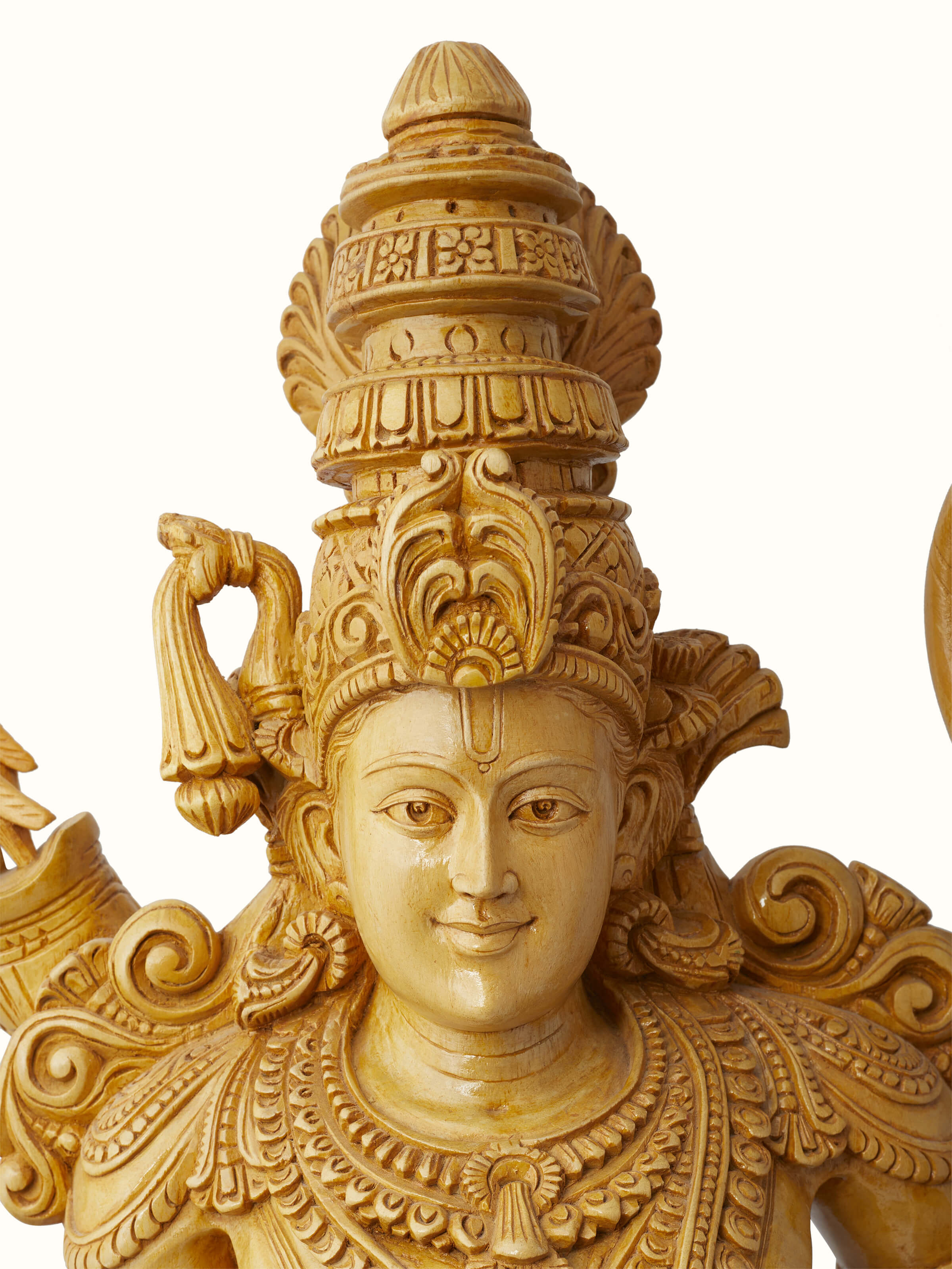 Close-up of Jaitra carved Shivani wood ram idol emphasizing the intricate design