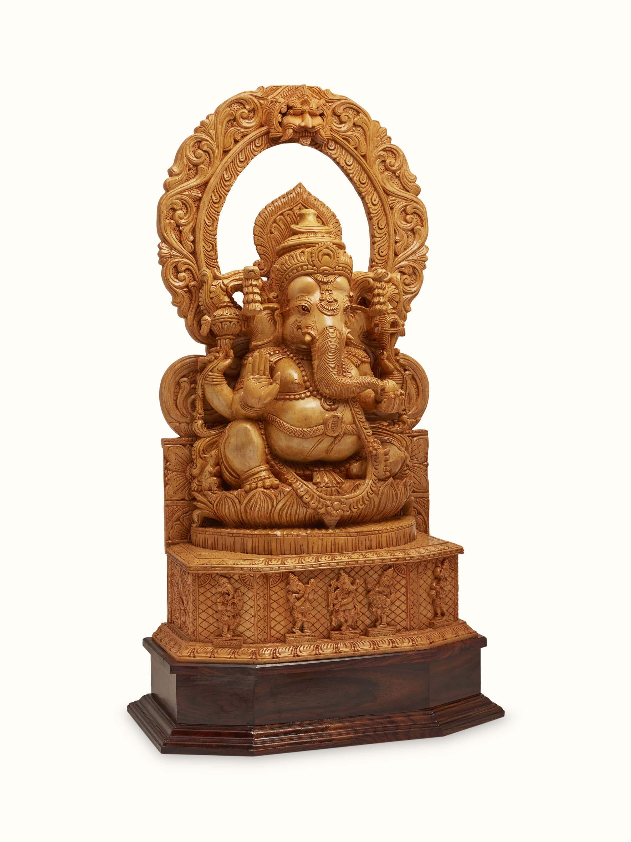 Detailed view of carved shivani wood Ganesha idol with prabhavali showcasing fine wood carving details