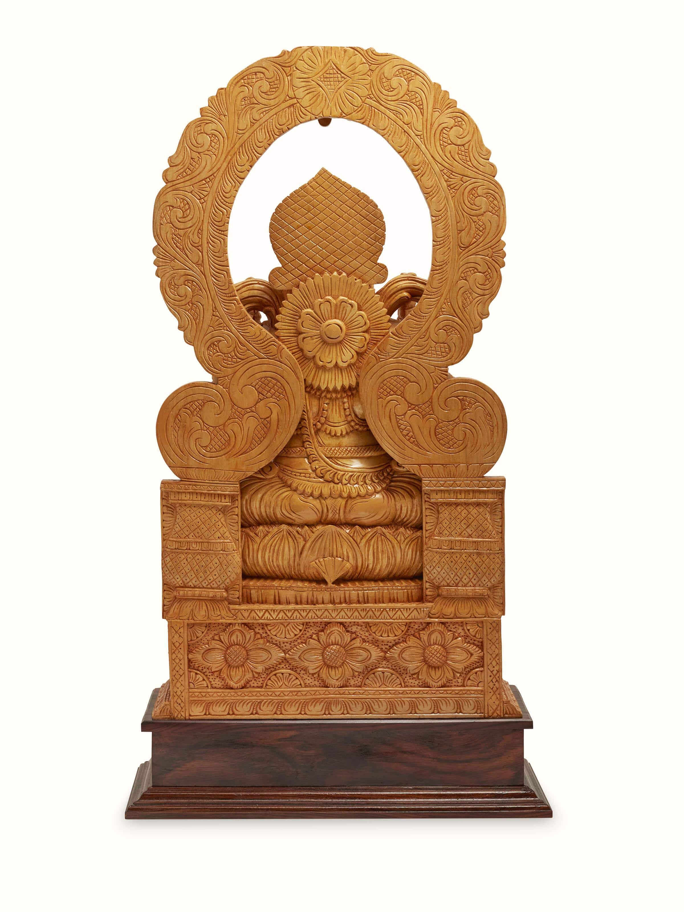 Close-up of carved shivani wood Ganesha idol with prabhavali showing intricate details and craftsmanship