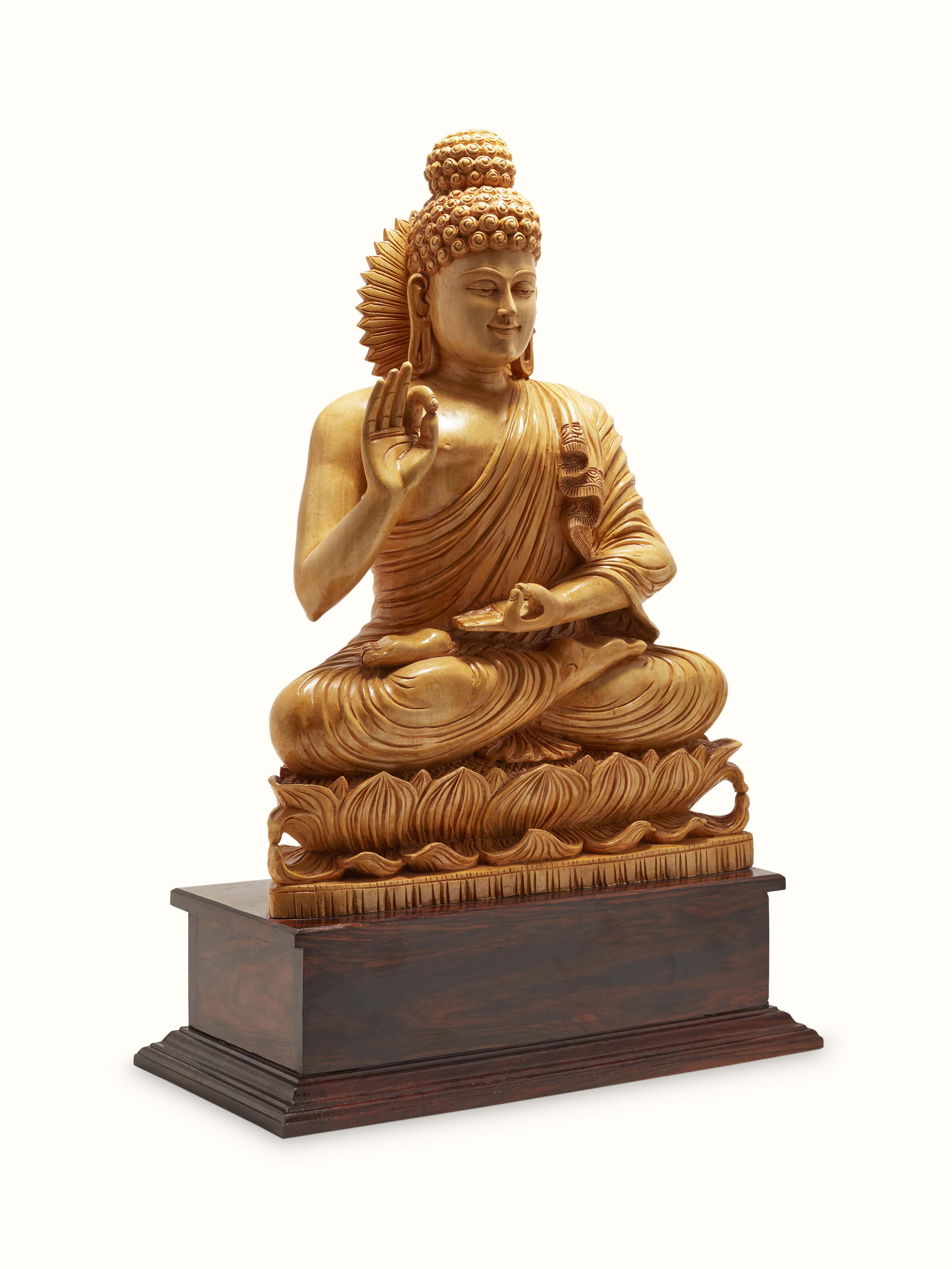 Angled view of Mudra Carved Shivani Wood Buddha Idol, showcasing the delicate features and carved details