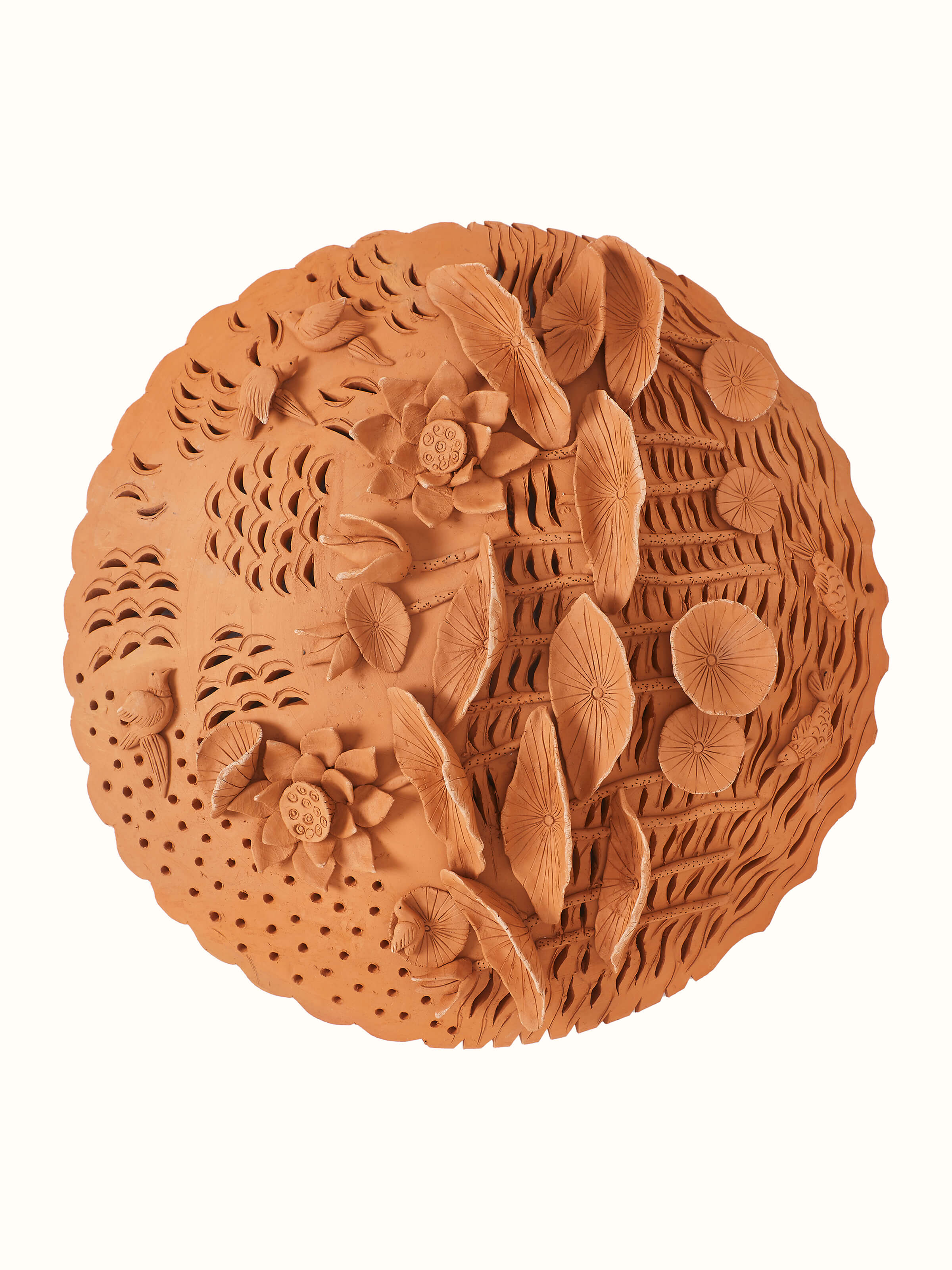 Side view of terracotta clay lotus cutout sculpture plate with detailed patterns