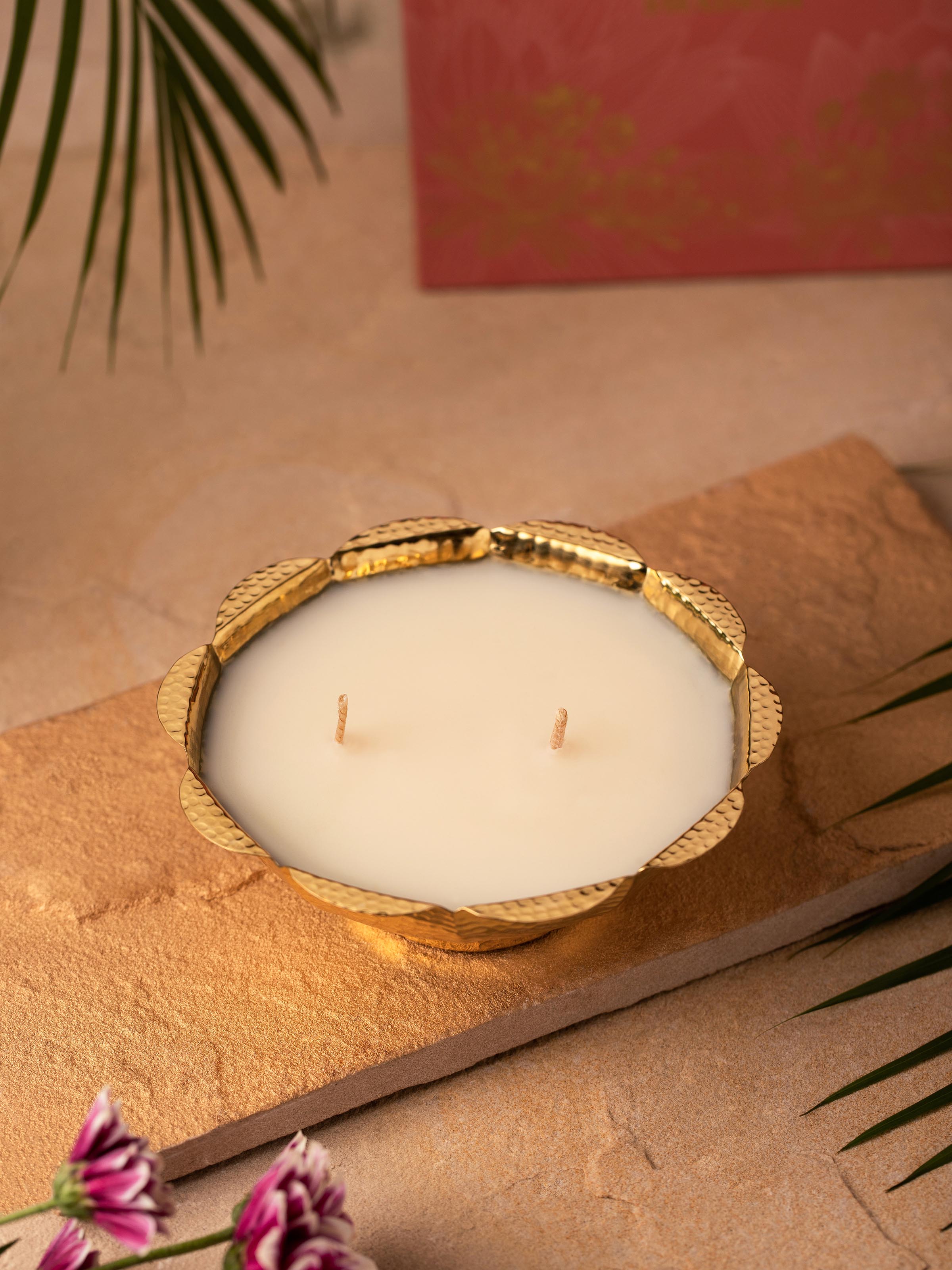 Close-up of the brass candle with two wicks, highlighting its detailed craftsmanship.