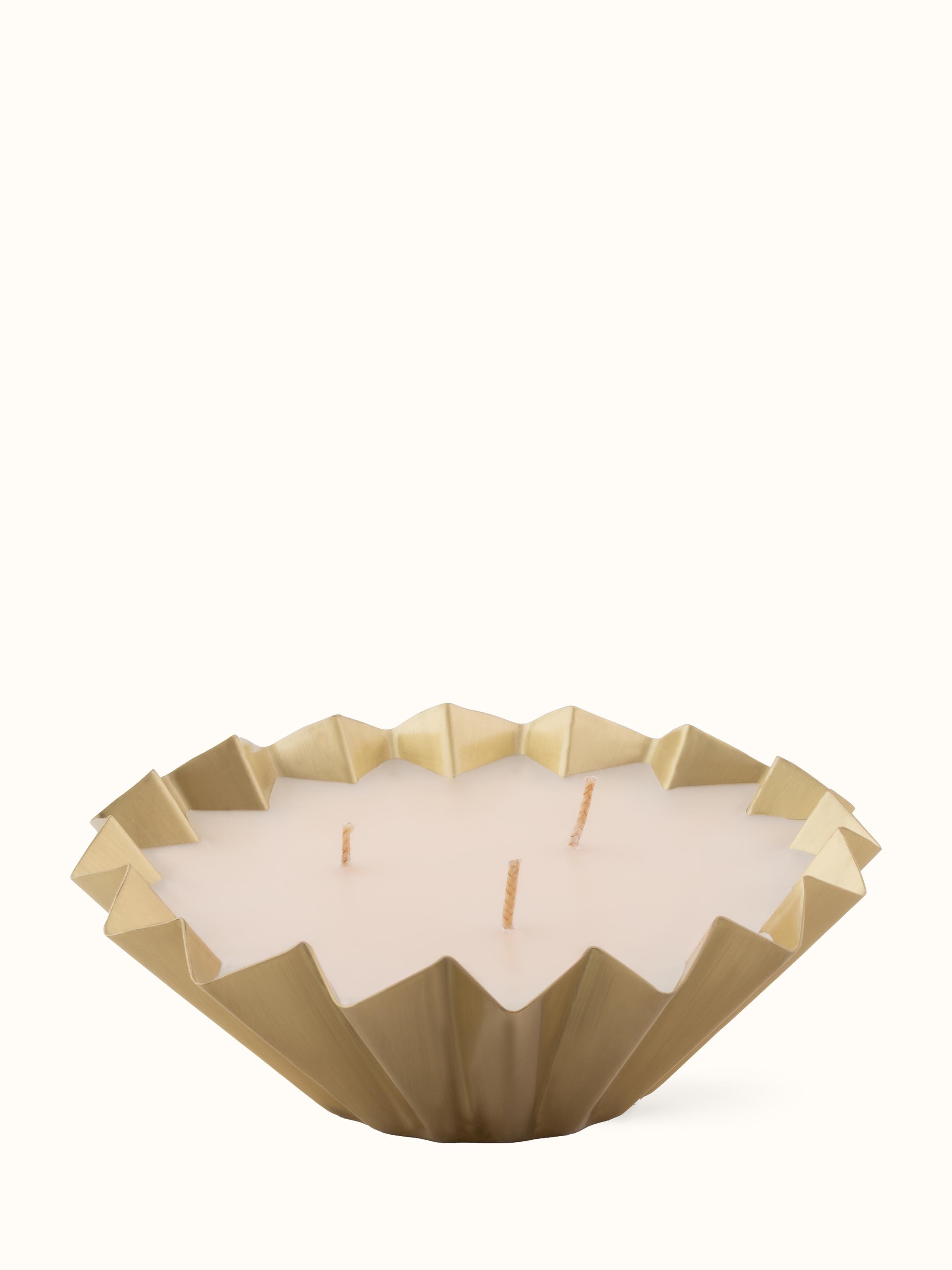 Front view of Vanilla Brass Candle featuring an elegant design with a warm glow