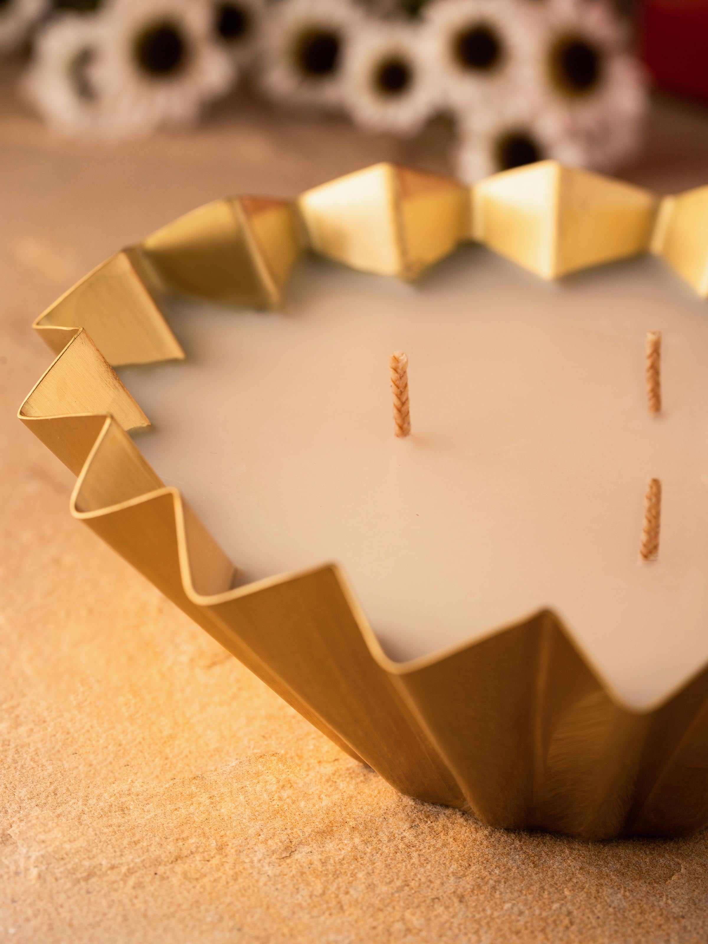Close-up of Vanilla Brass Candle showcasing the flickering flame and soothing ambiance
