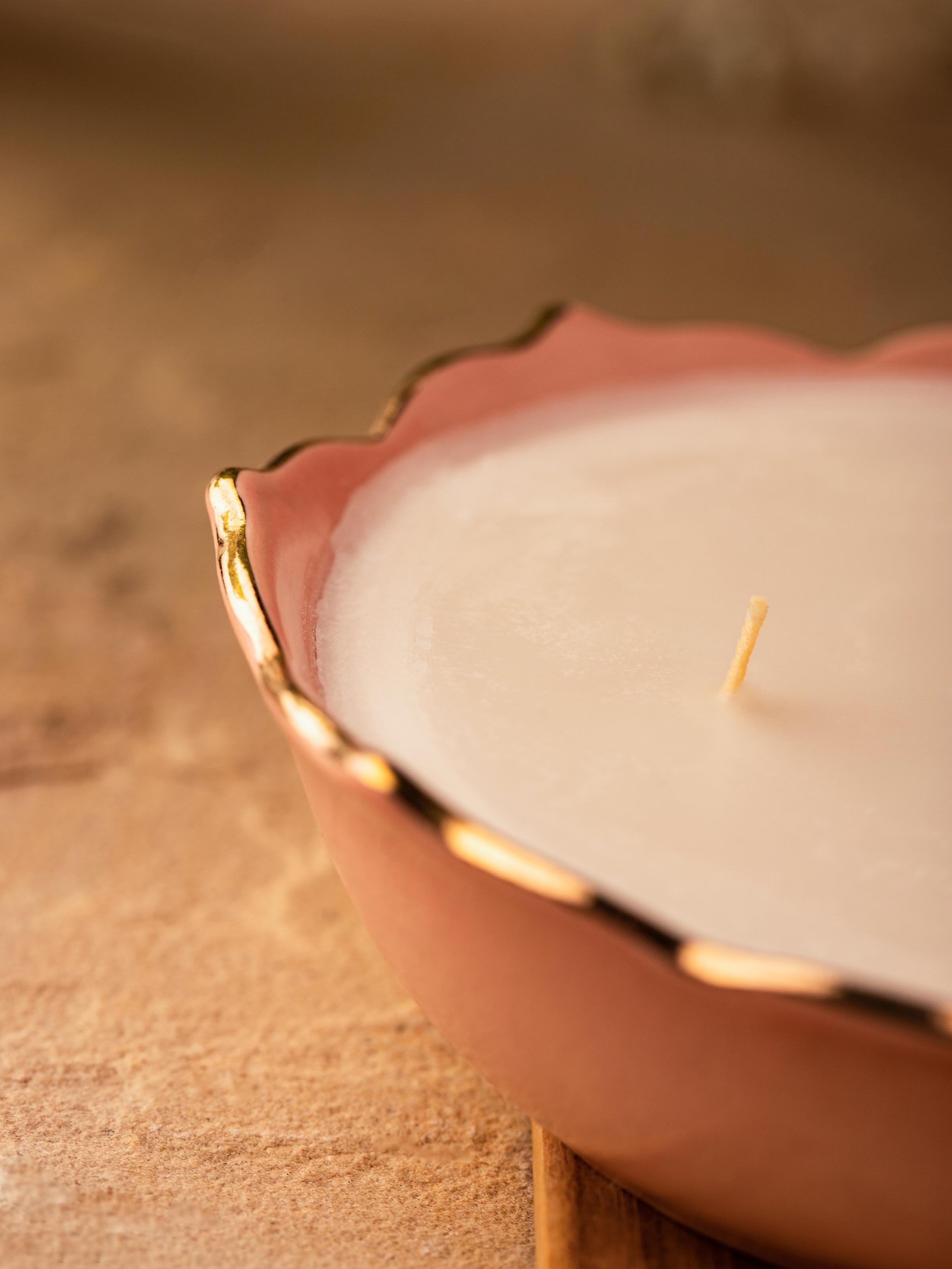 Close-up of Pink Ceramic Candle focusing on the detailed craftsmanship and glossy surface.