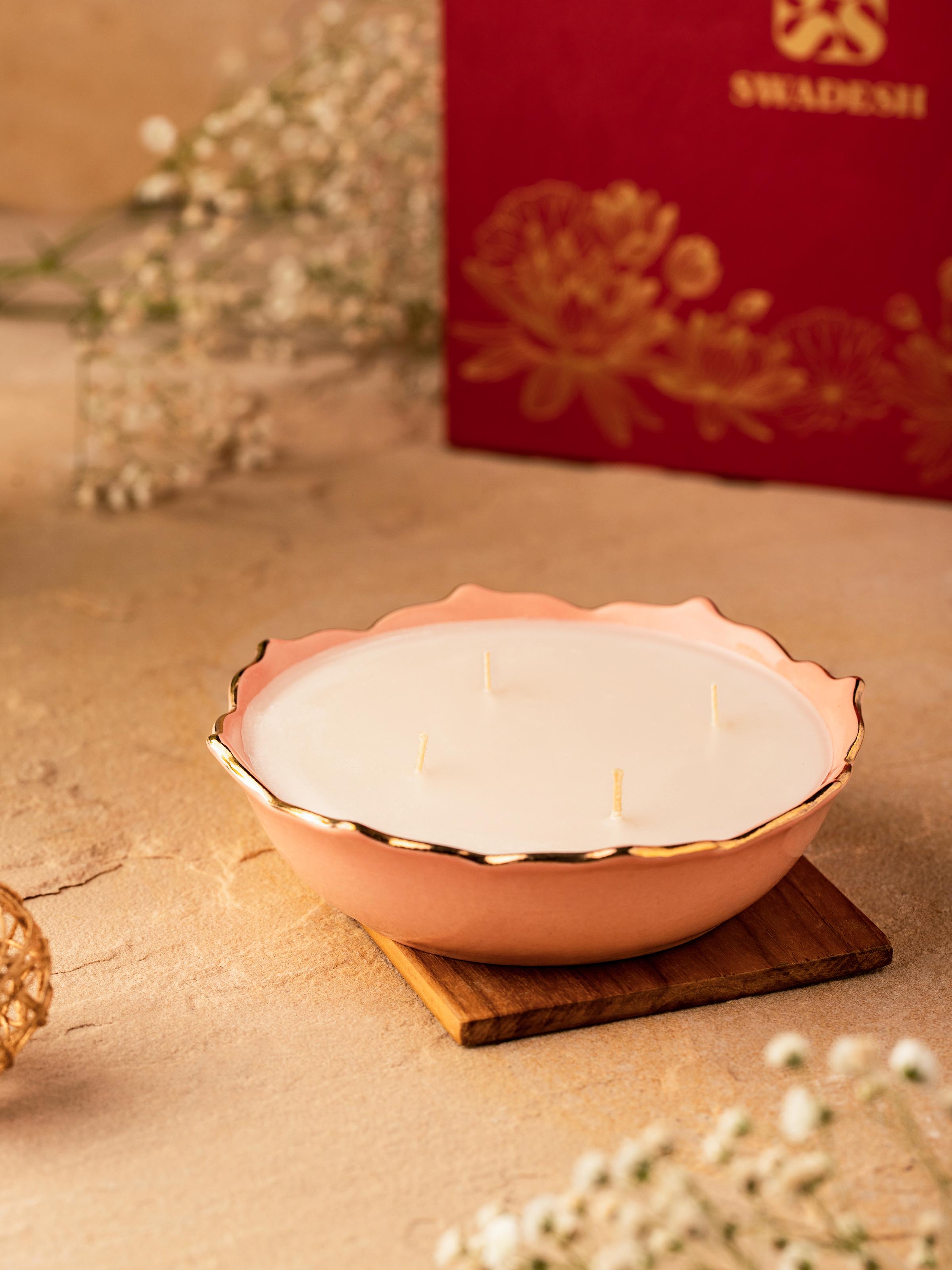 Side view of Pink Ceramic Candle showcasing the refined texture and vibrant color.