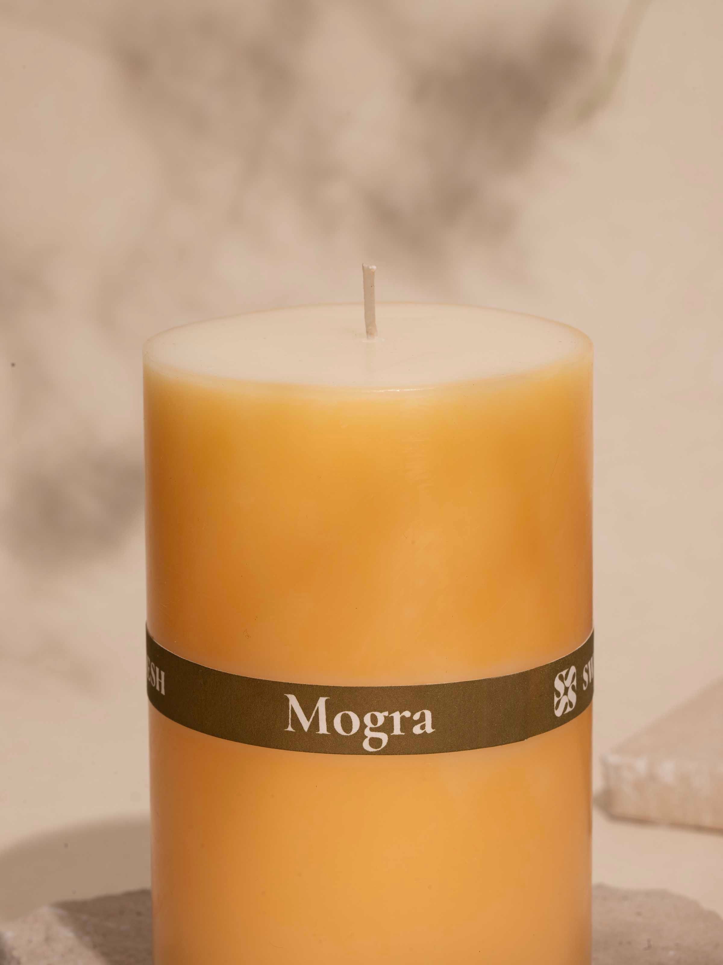 Mogra pillar candle (4.5 inches) showing its elegant floral pattern in natural light.