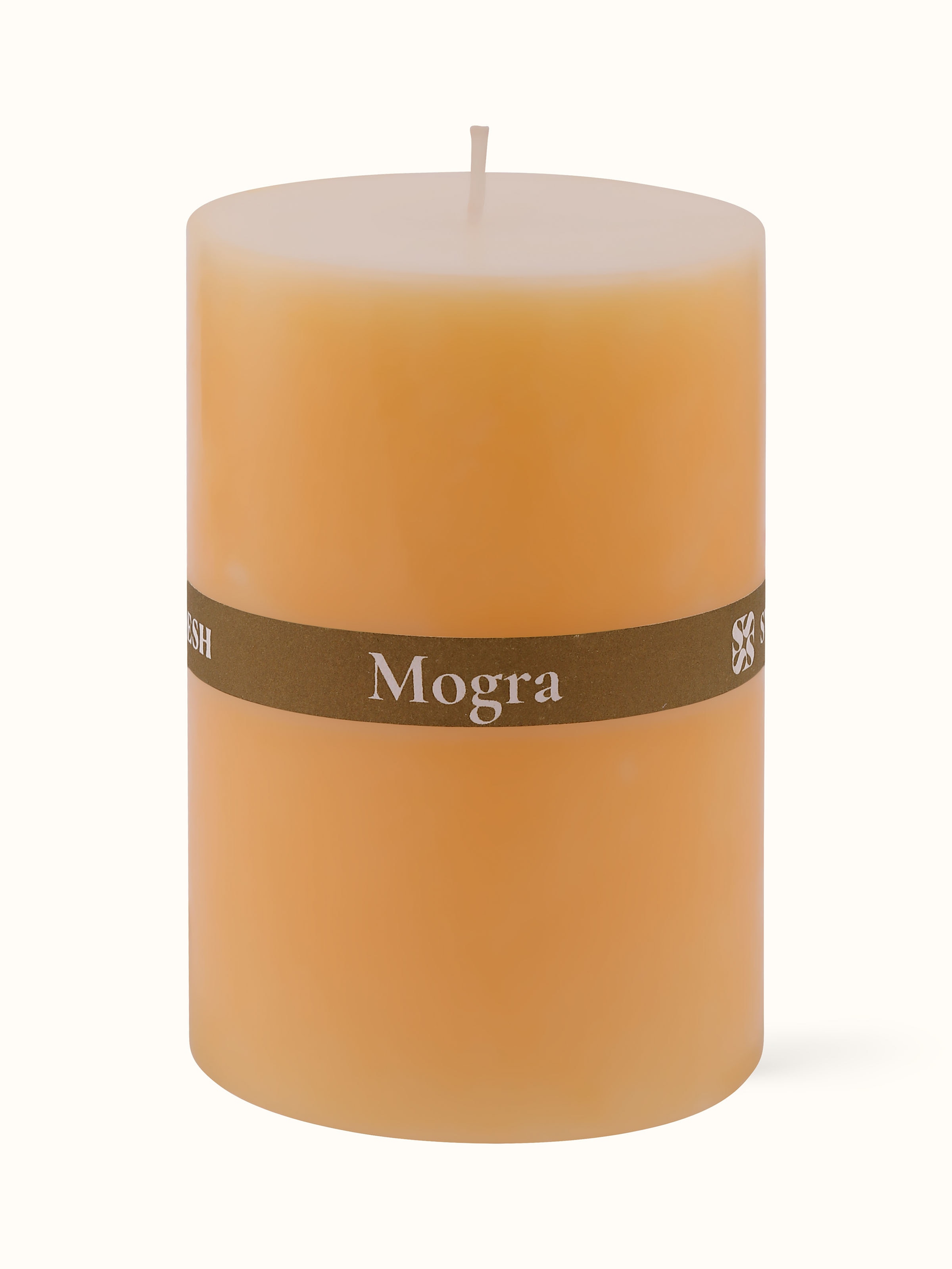 Mogra pillar candle (4.5 inches) placed on a surface, emphasizing its smooth, decorative finish.