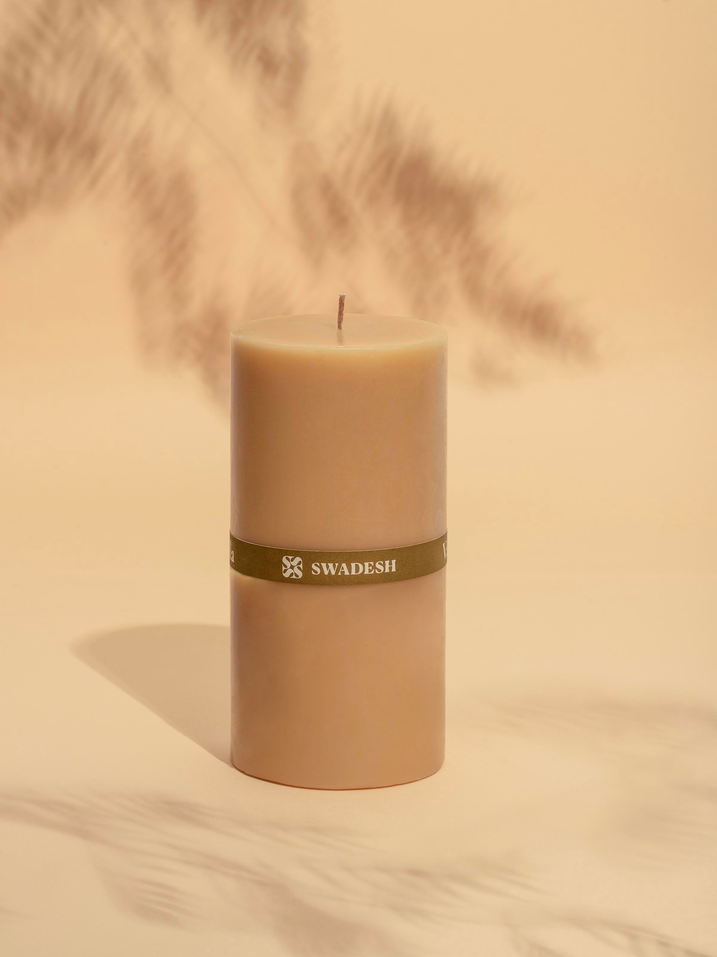 Side view of Vanilla Pillar Candle (6 inches) highlighting the candle's texture and color.