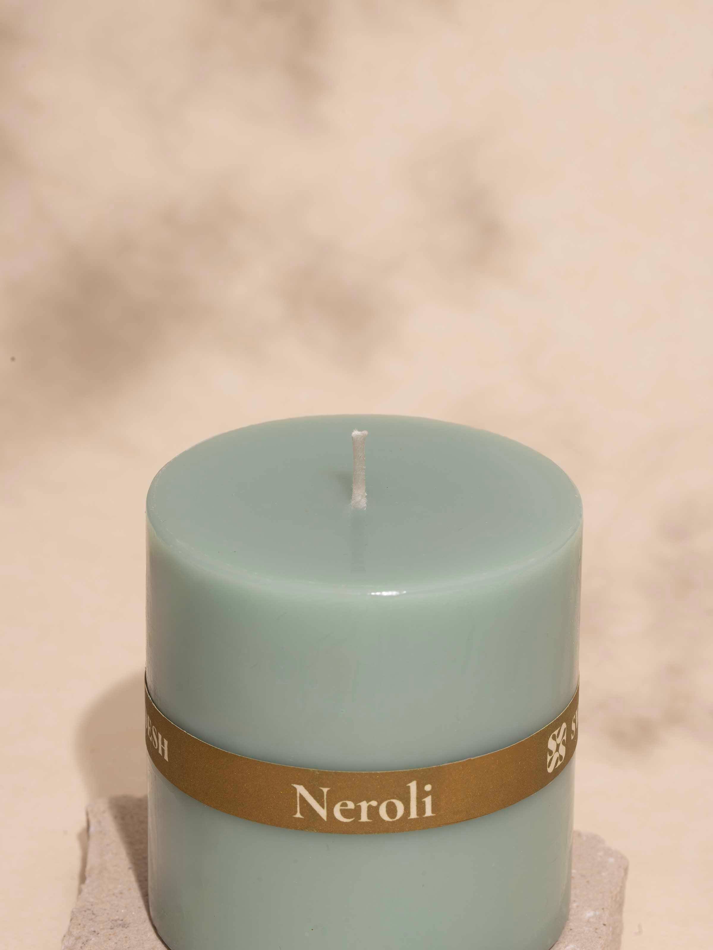 Detailed close-up of Neroli Pillar Candle (3 inches) showing the label and the candle's refined surface.