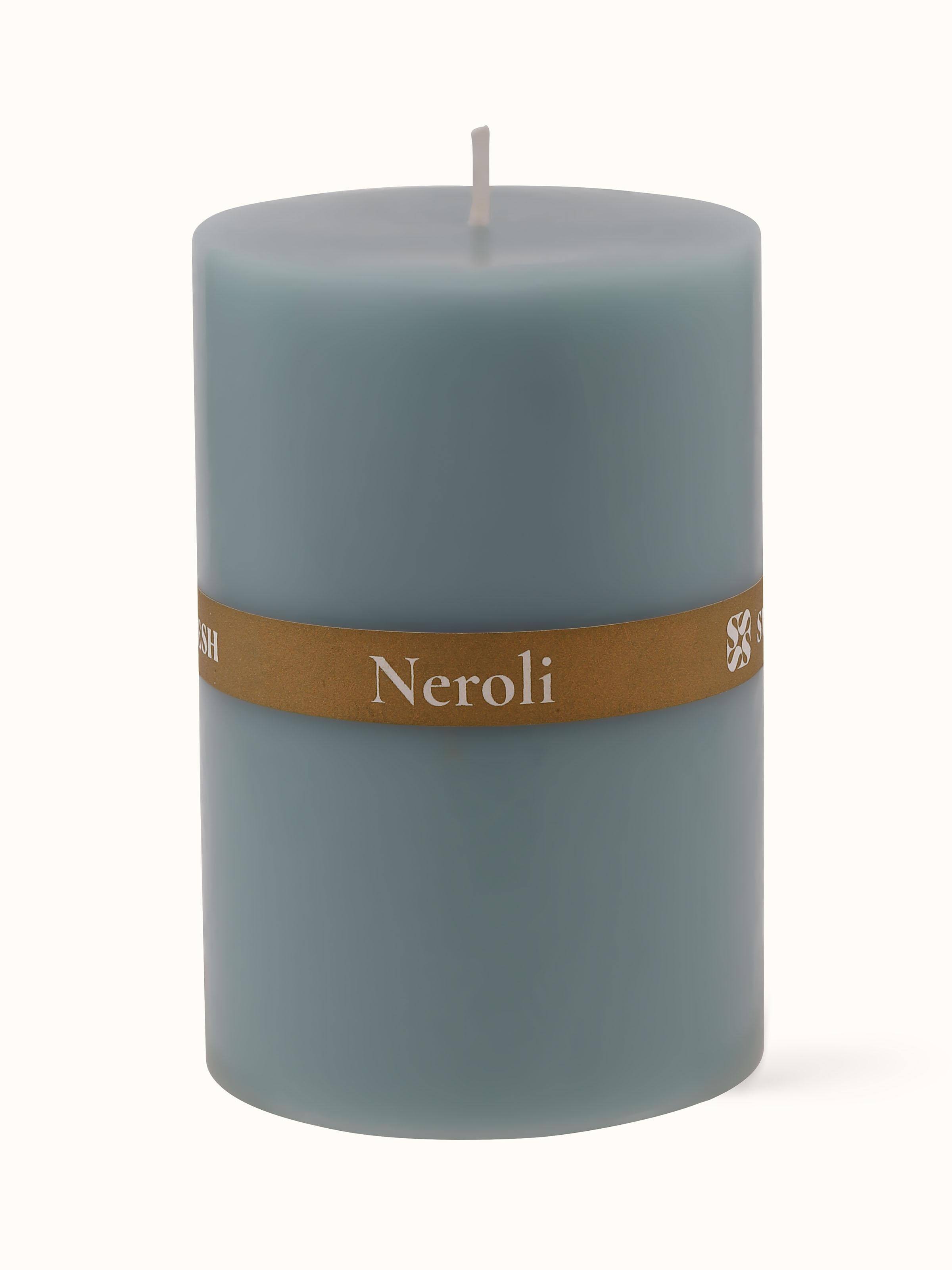 Neroli Pillar Candle displayed with natural elements, creating an inviting atmosphere