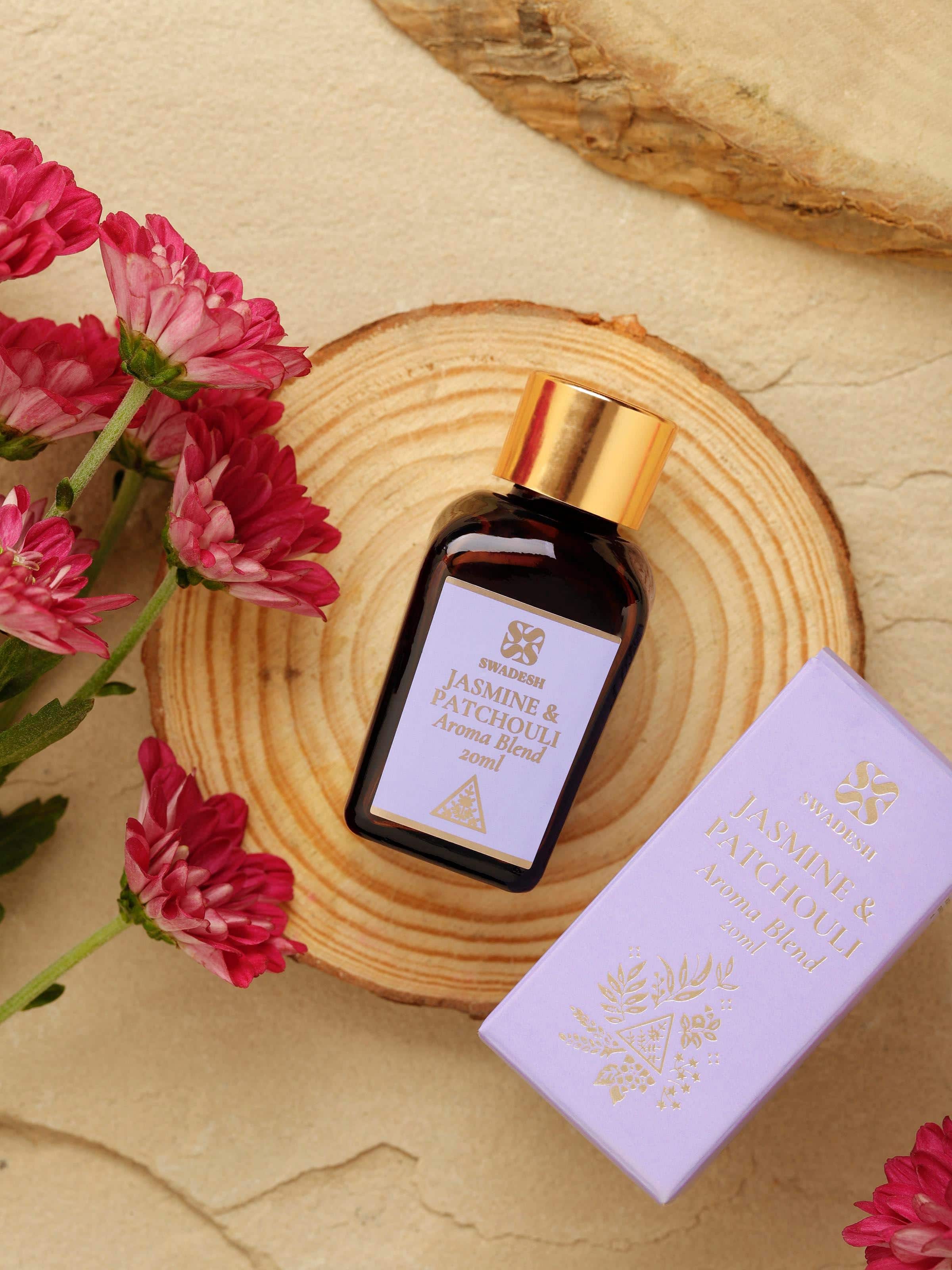 Side view of Aroma Blend Jasmine & Patchouli bottle, emphasizing the sleek design.