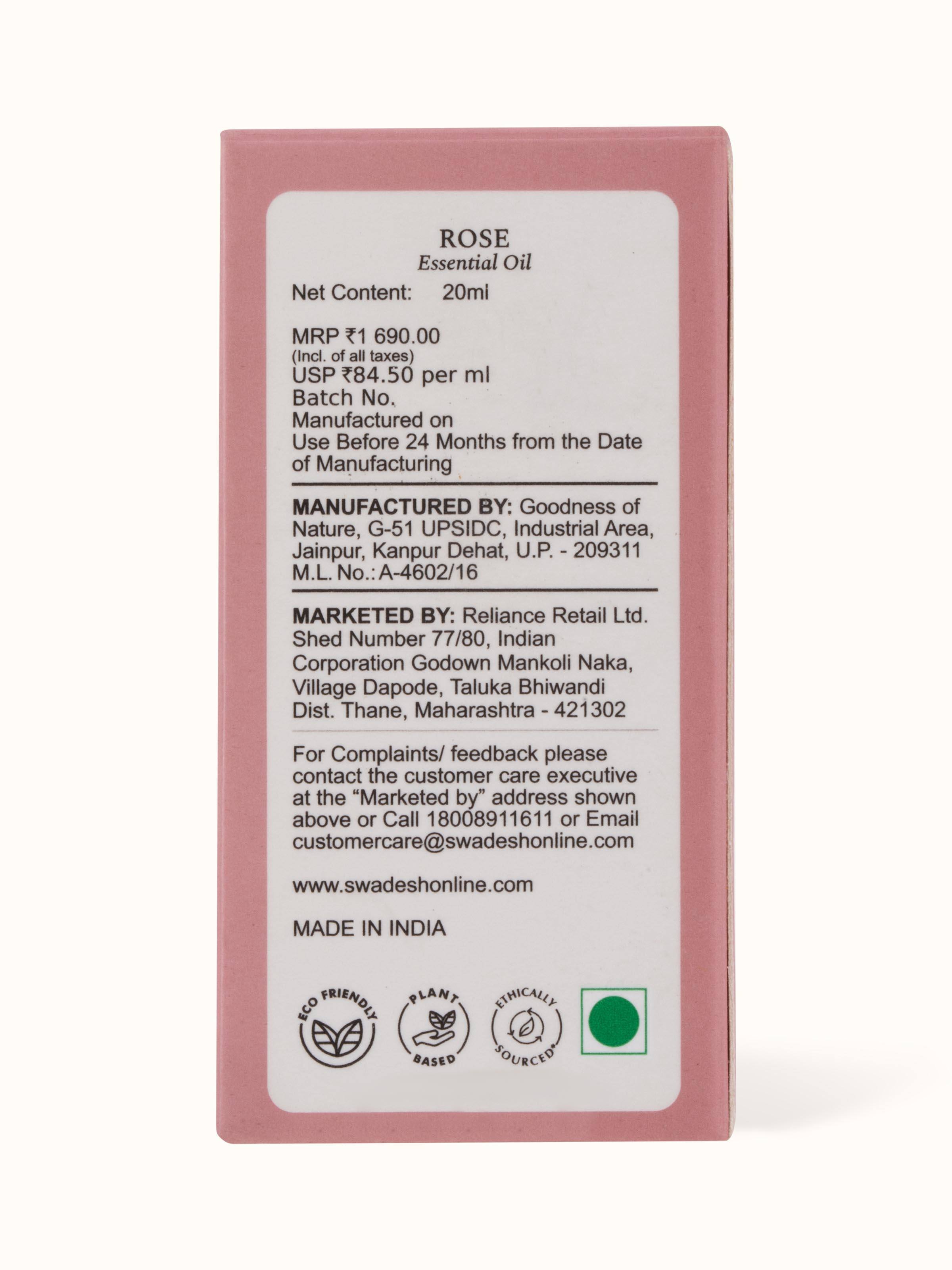 Essential Oil Rose displayed with rose petals, emphasizing its natural essence