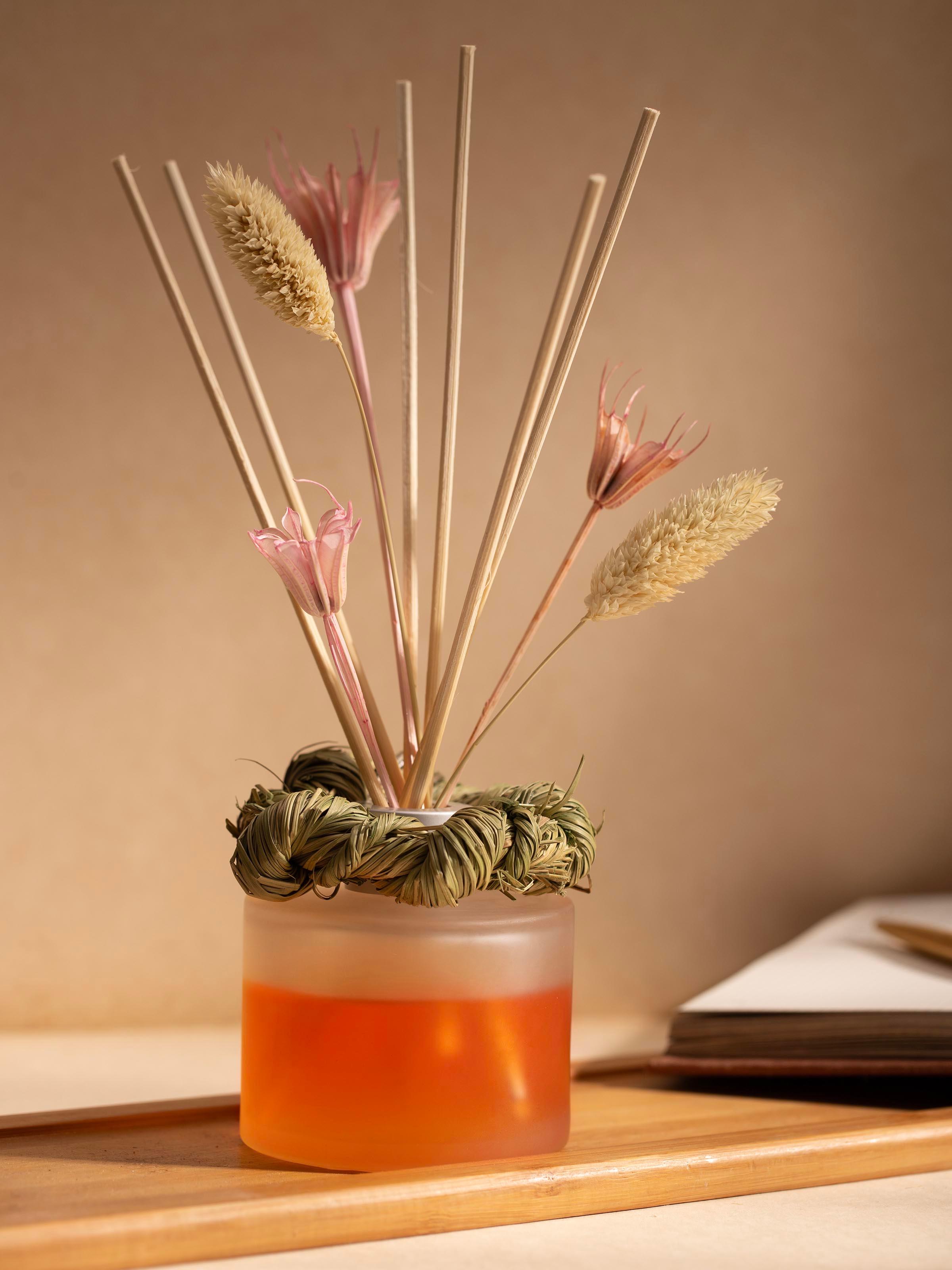 Side view of Tuberose Aroma Reed Diffuser (50 ml) highlighting the bottle's design and reed placement.