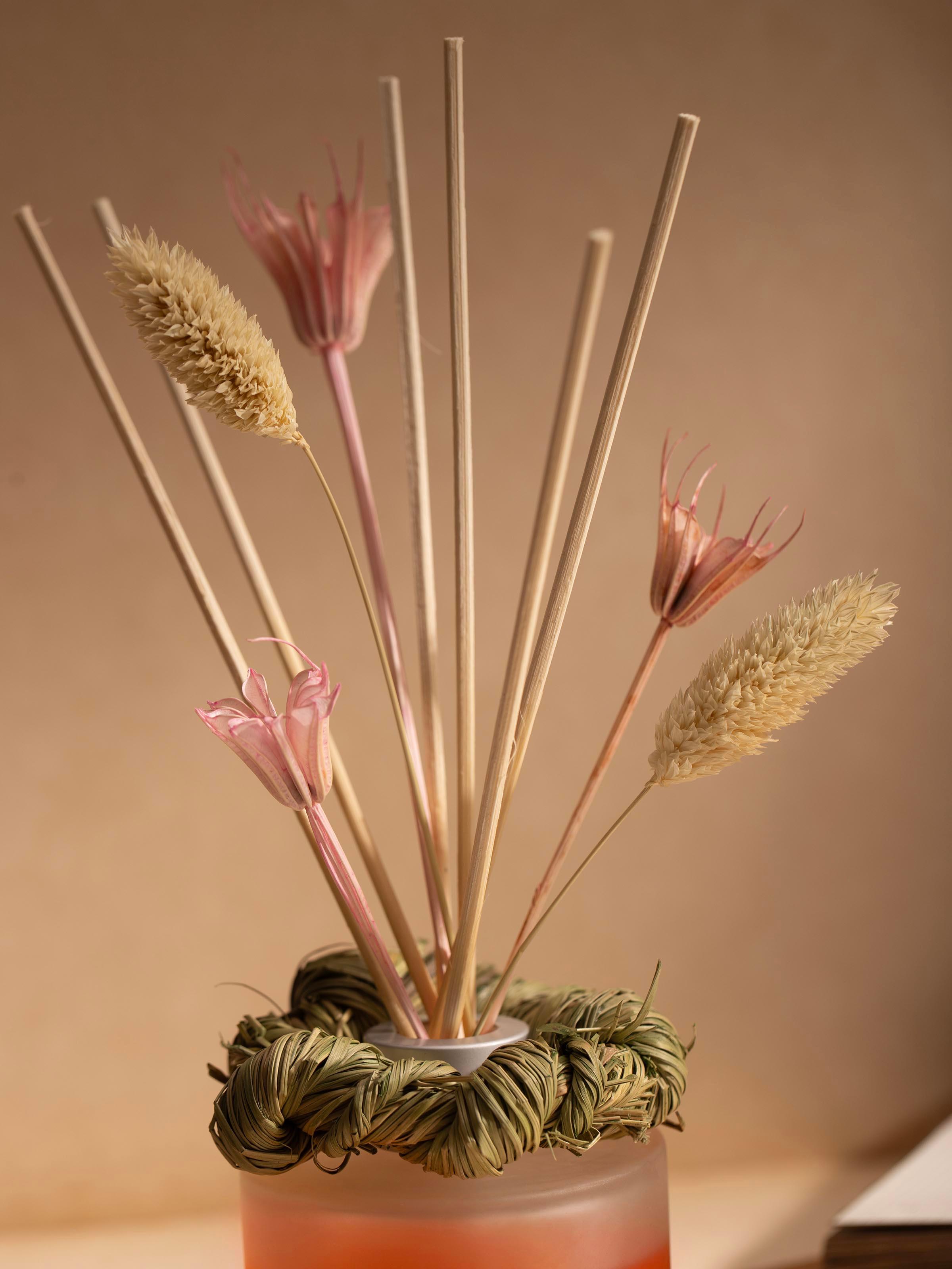 Close-up of Tuberose Aroma Reed Diffuser (50 ml) focusing on the diffuser's liquid level and reed texture.