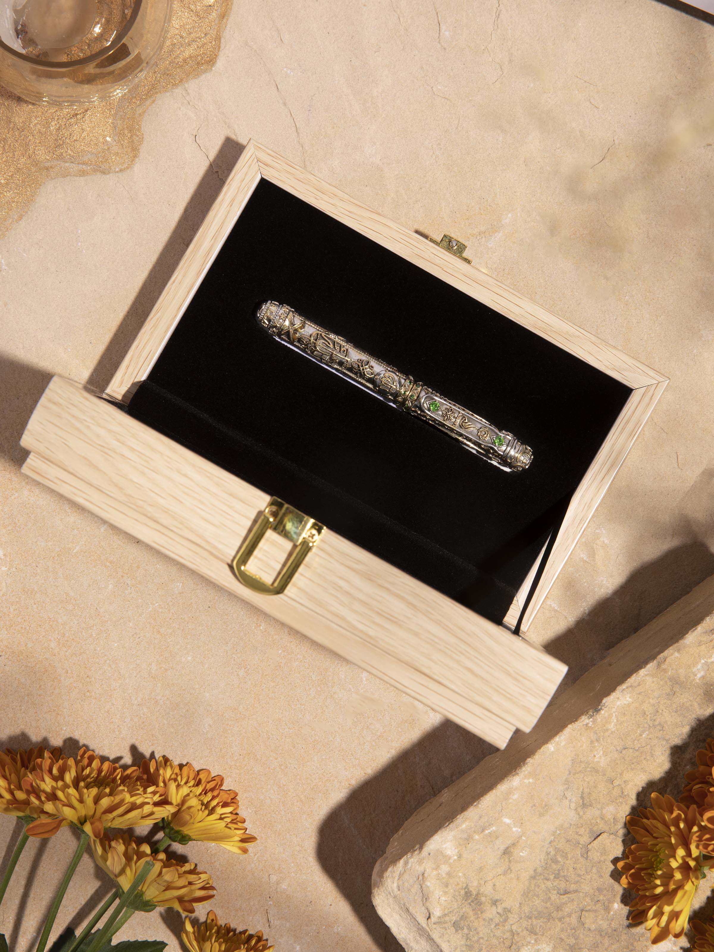 Close-up of Silver Smithing Divine Pen highlighting the refined silver detailing and craftsmanship.