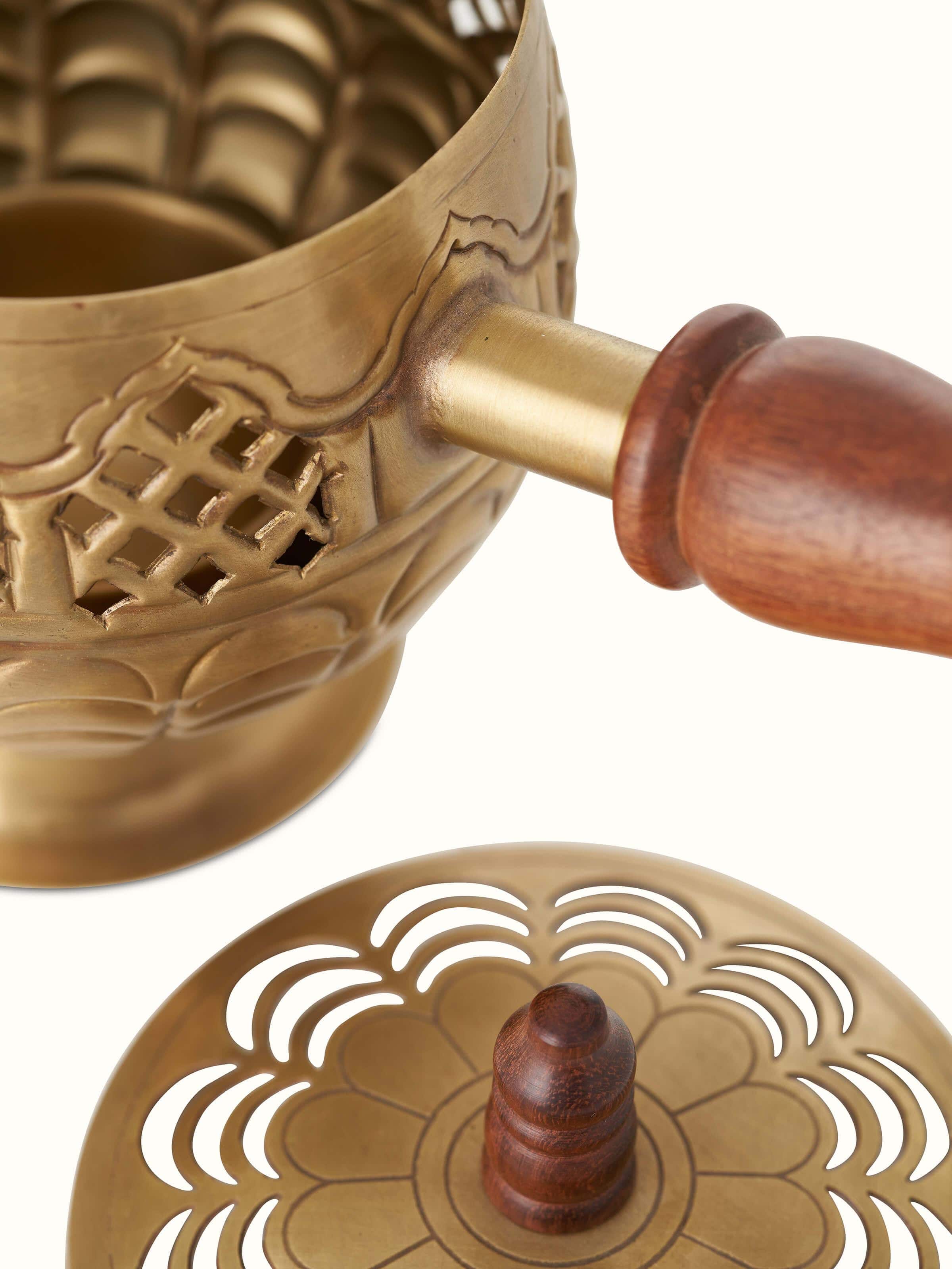 Detail view of Polished Brass Dhuna highlighting the fine metalwork and decorative elements.